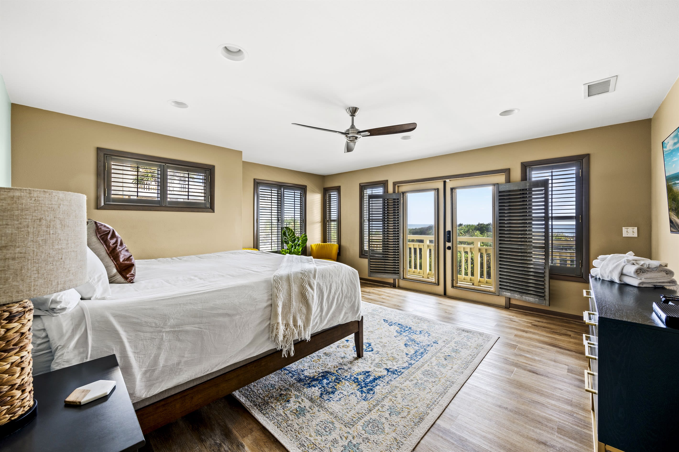 Experience spaciousness and personal space in the lower floor Master bedroom suite, equipped with all the modern comforts, TV, A/C and ceiling fan.