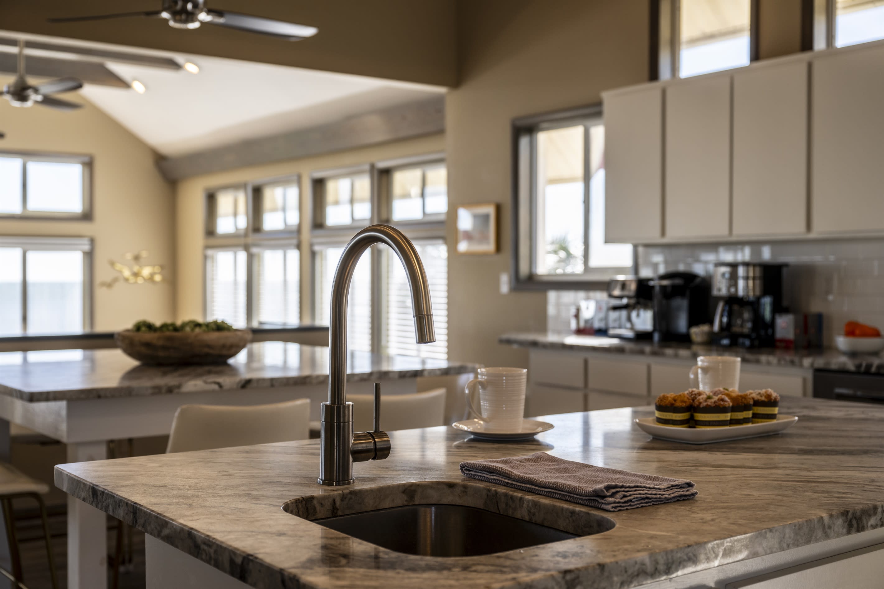 The spacious layout and high-end amenities make it the perfect space for hosting and enjoying meals with stunning ocean views.