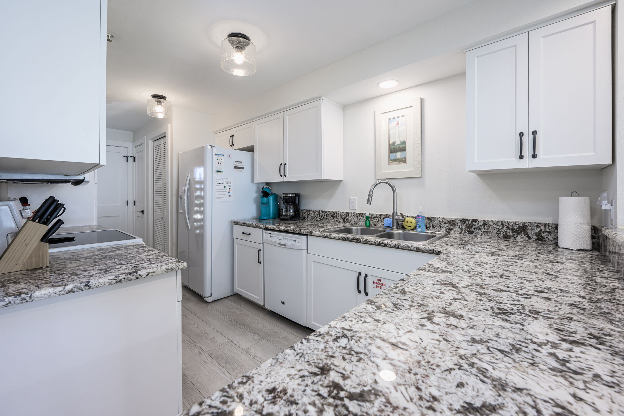 "Whip up your favorite meals in this bright and fully-equipped kitchen, featuring granite countertops and modern appliances. ??? #BeachsideCooking #VacationEats"