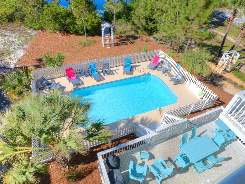 Private Pool overlooking lake. Plenty of seating. Grill for poolside dining.
