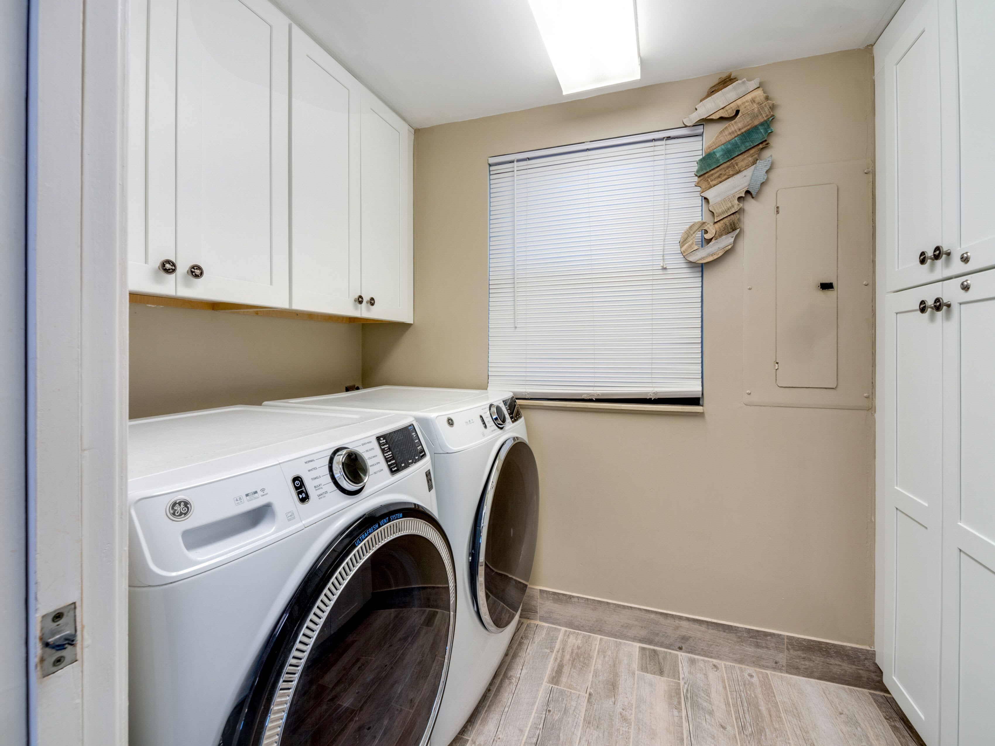 Laundry room with full size washer and dryer