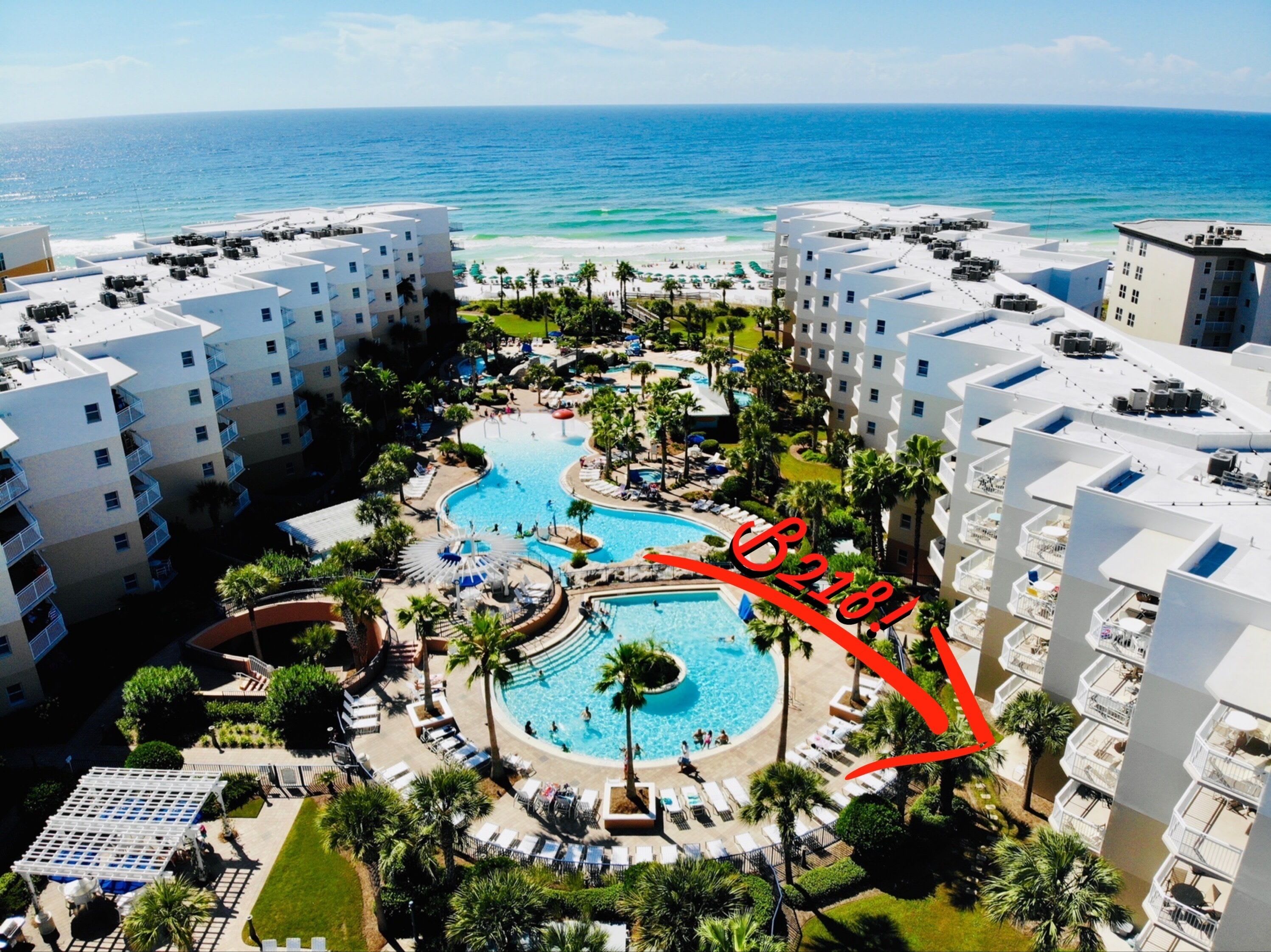 B218 is a ground level unit! The back patio walks straight out to the pools!