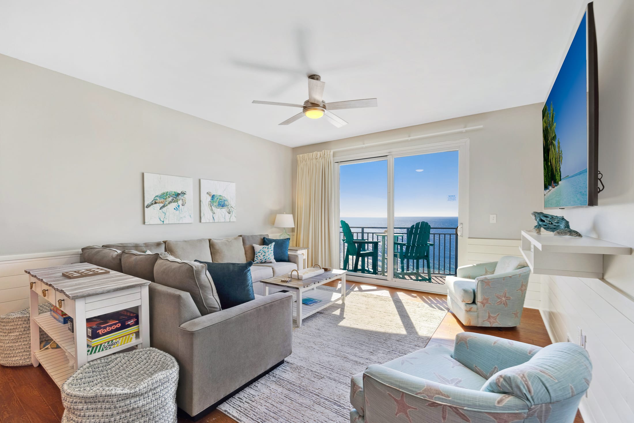 The sectional sofa, two captains chairs and two poufs (next to the console table) provide plenty of seating for hanging out in the living room.