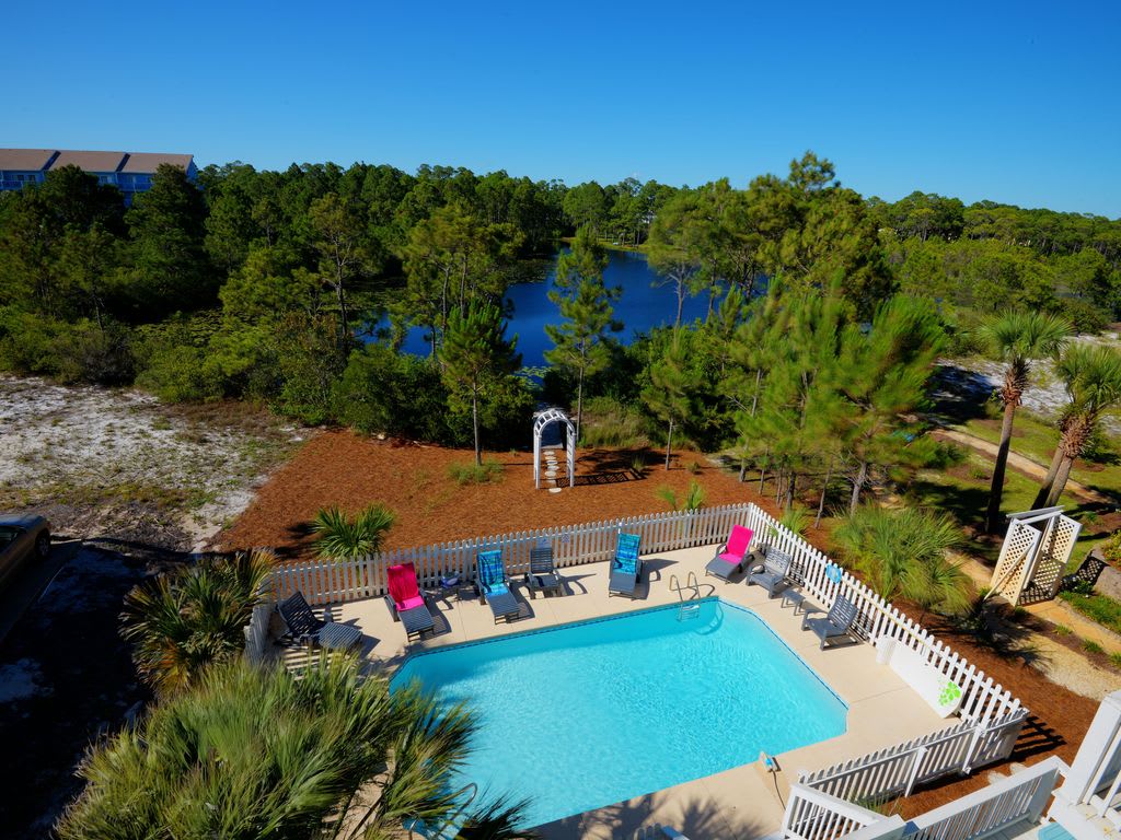Lake directly behind pool area/house. Private dock added in 2020. Just steps away for fishing!