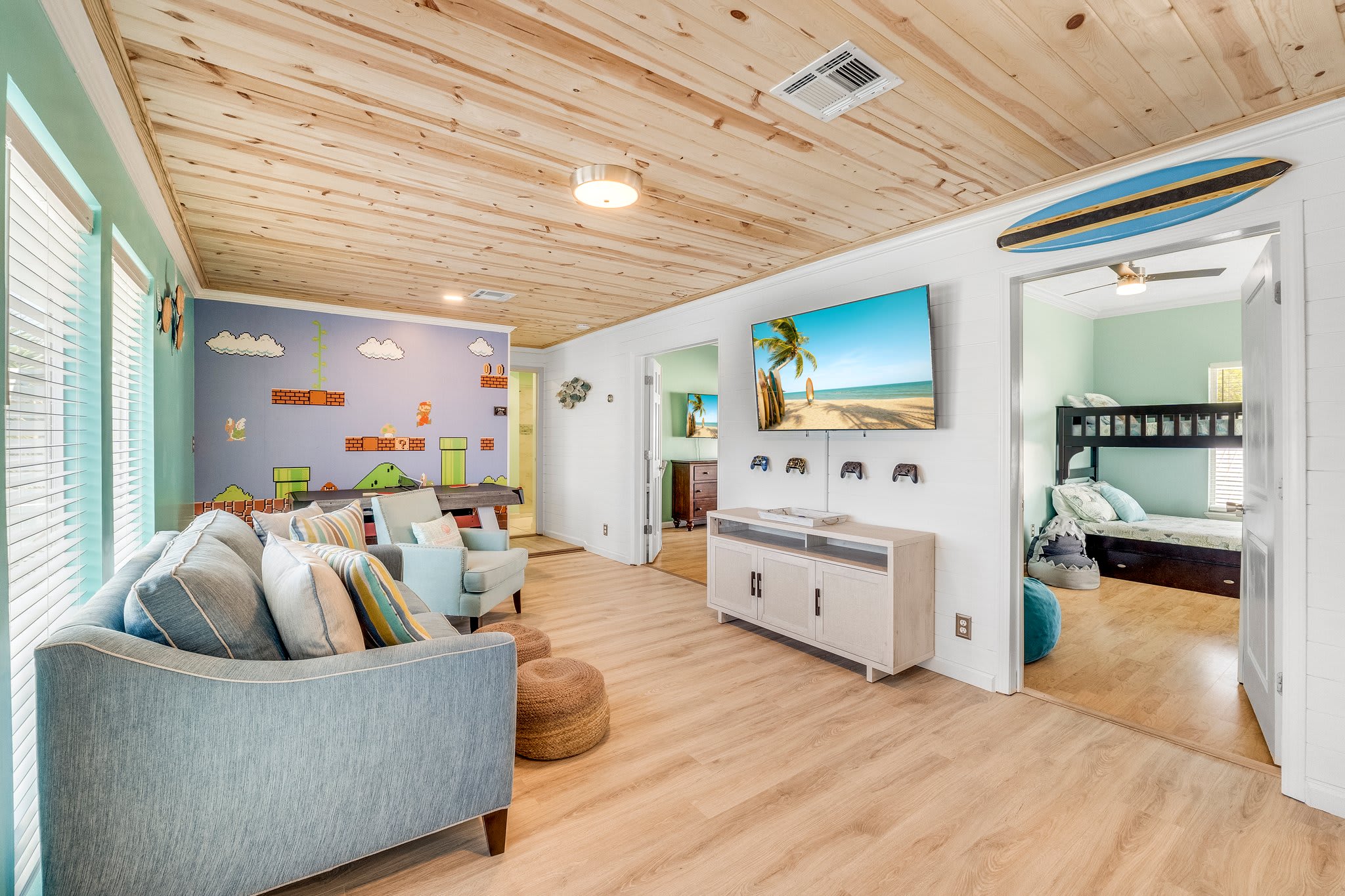 The Game Room is located on the second level  and includes Teenage Mutant Ninja Turtles arcade game, Marvel pinball machine, air hockey/ping pong table, mini fridge, and game stick with countl