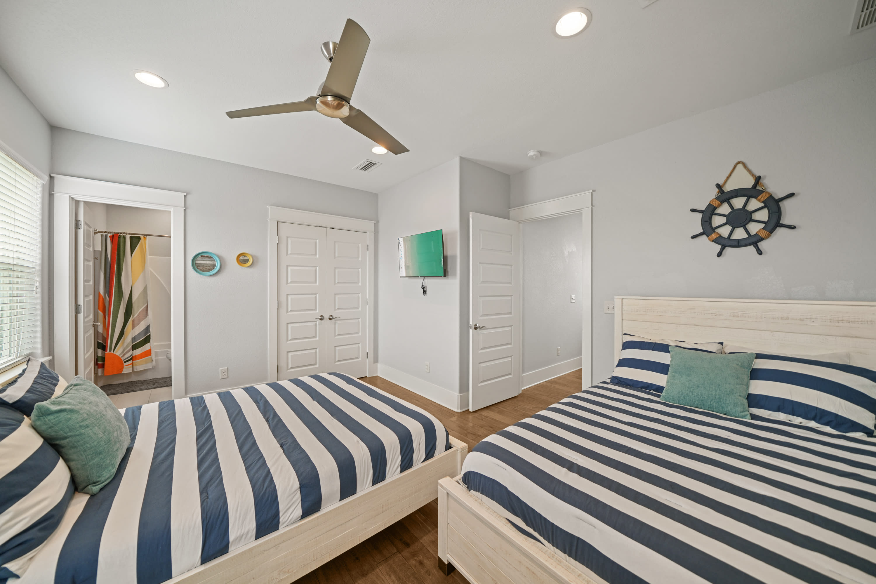 Double Queen Suite featuring two queen beds and coastal-inspired décor.