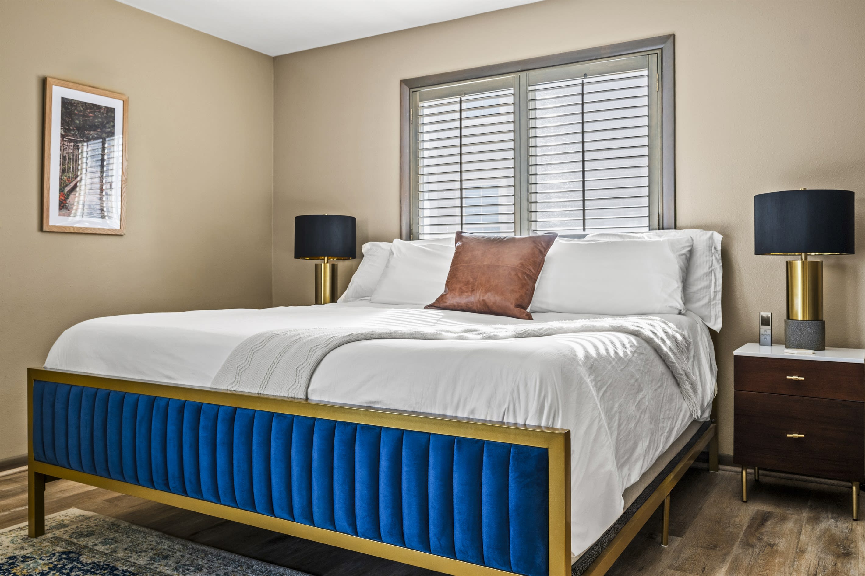 Third king guest bedroom connects to a bathroom and deck.Modern amenities and plenty of storage in this spacious king bedroom. The room is designed for comfort and functionality, featuring amp