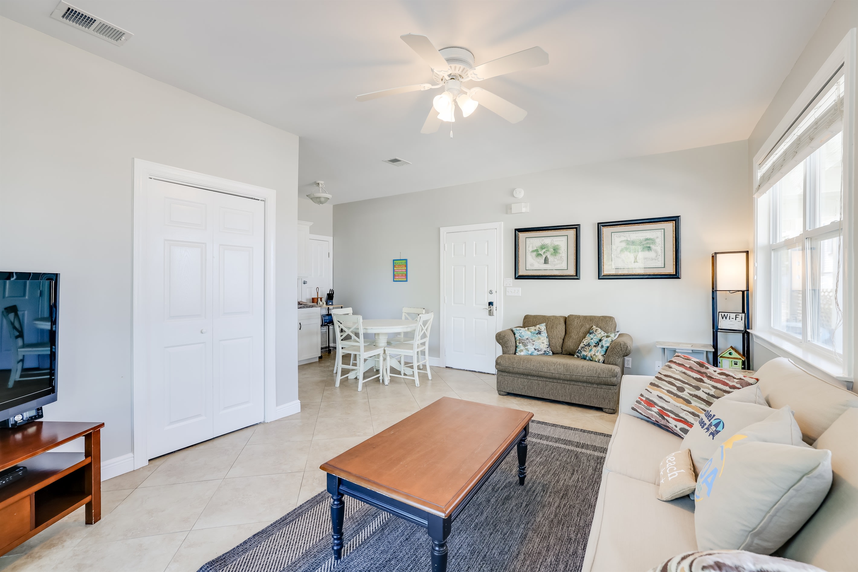 In Law living room with kitchenette and dining seating for four.