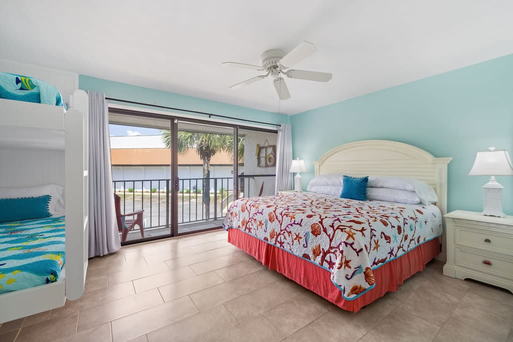 Bedroom 3, King with twin bunks, full bath & balcony access.
