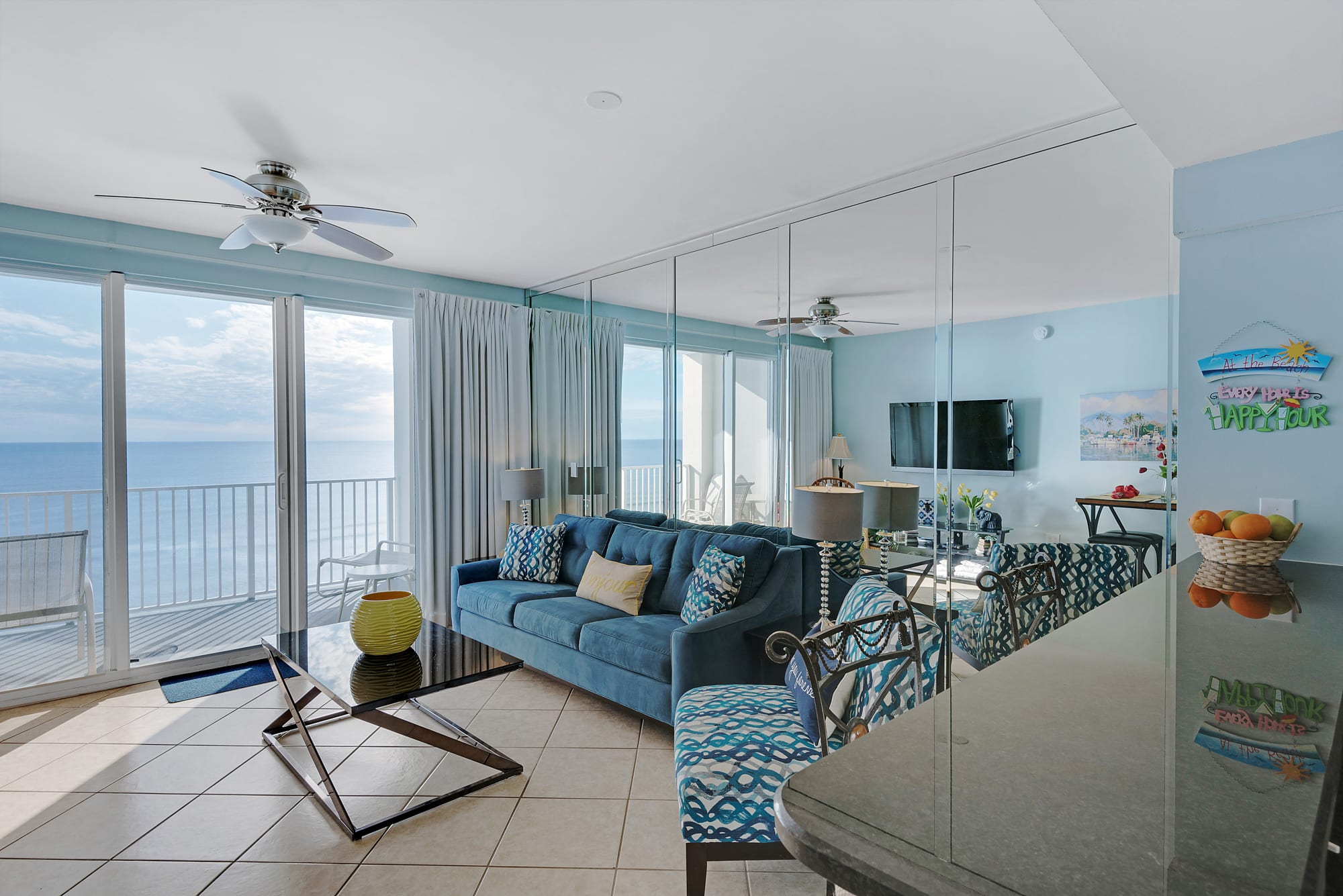 The living room has a Large Flat screen tv 2 chairs and the sofa is a queen sleeper