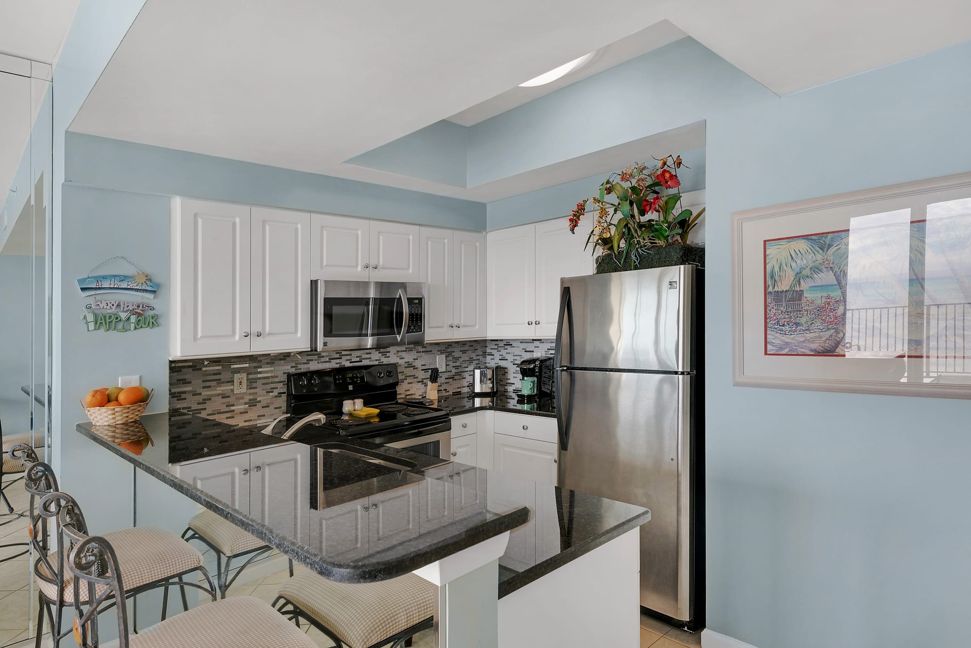 The kitchen features granite counters and Stainless steel appliances