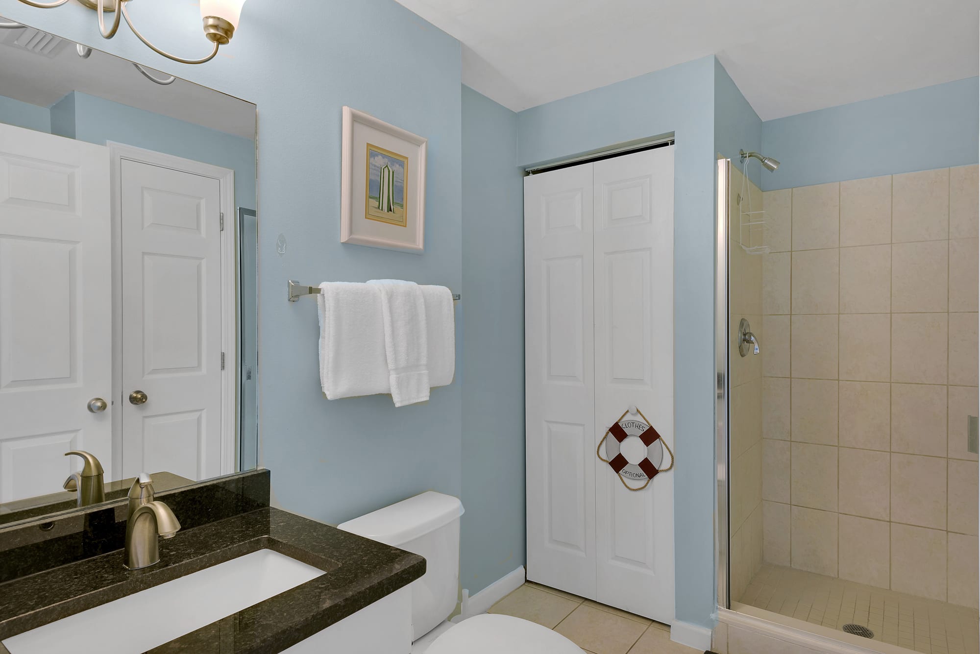 This condo has a guest bath with walk in shower