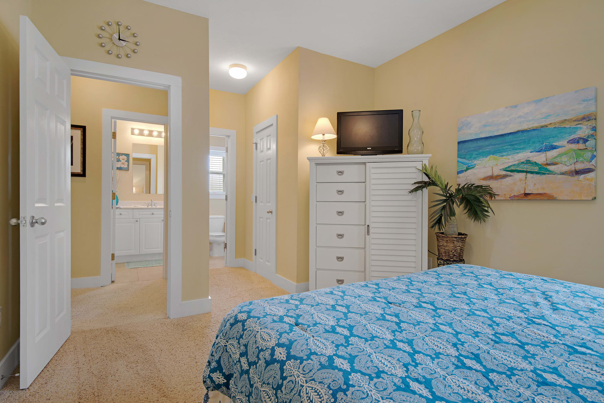 second floor queen bedroom has flat screen tv and access to bath