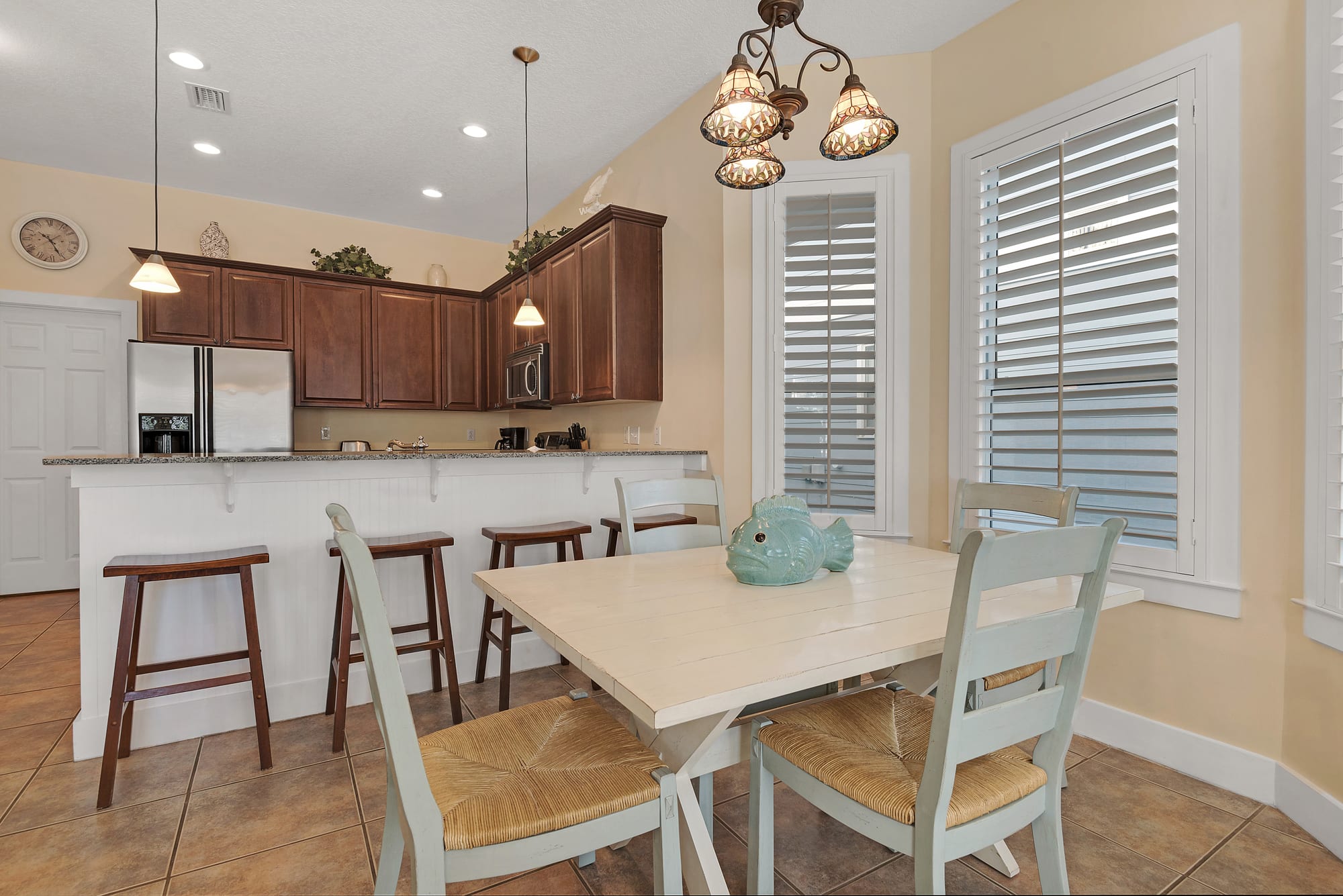 With 4 chairs and a bench you can seat at least 6 at the dining table 