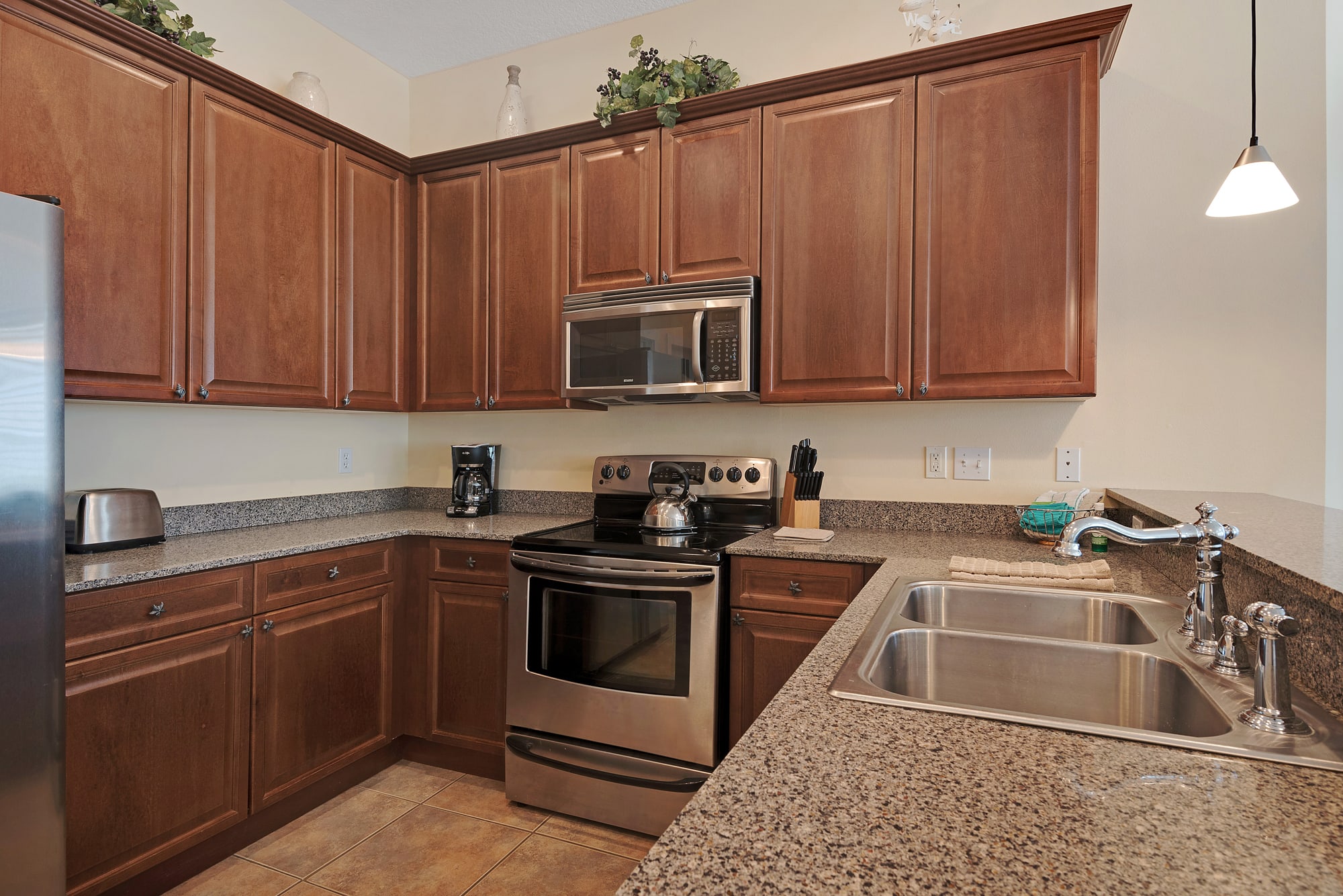 Ktichen features stainless steel appliances &amp; granite countertops