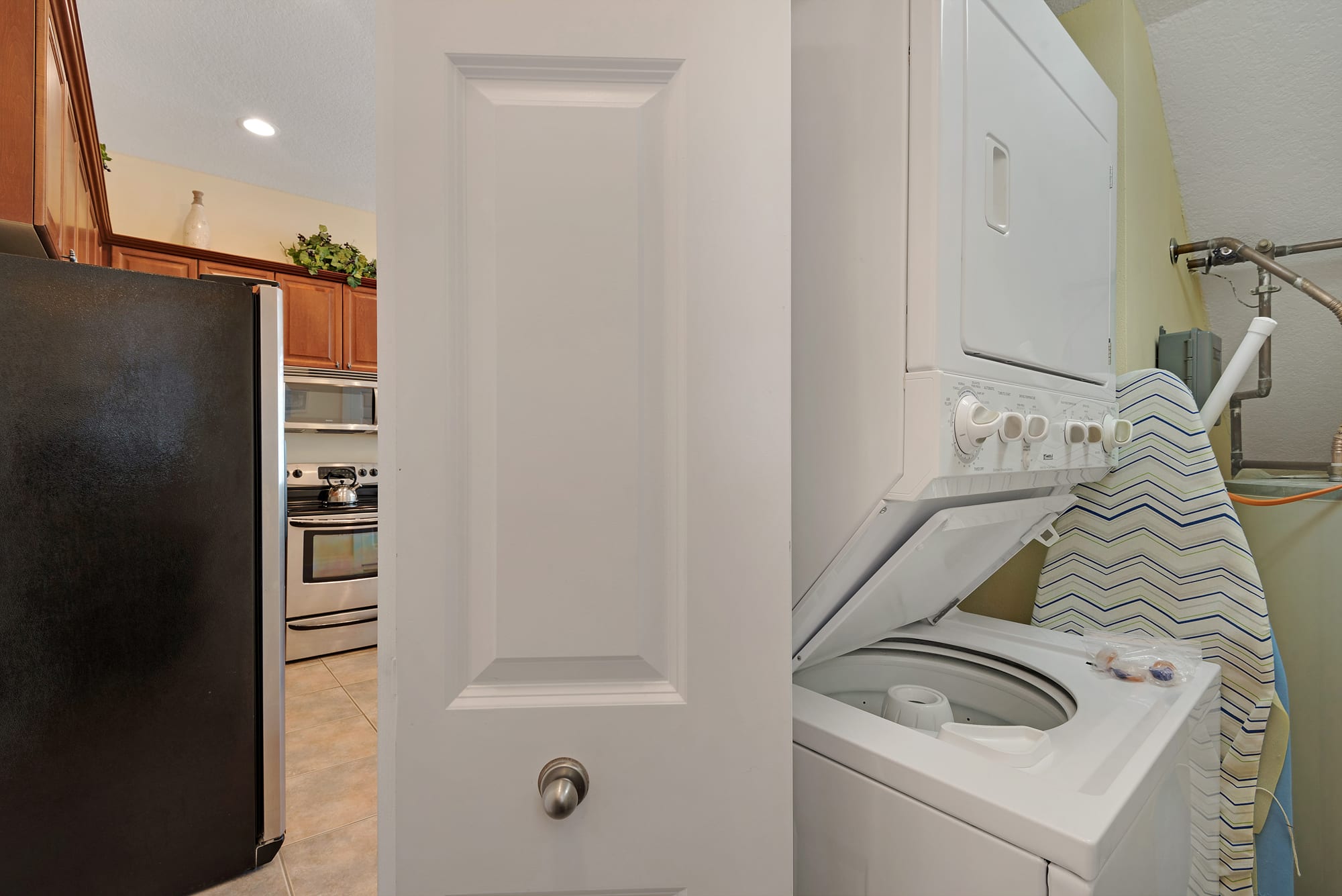 Laundry room has stackable washer/dryer