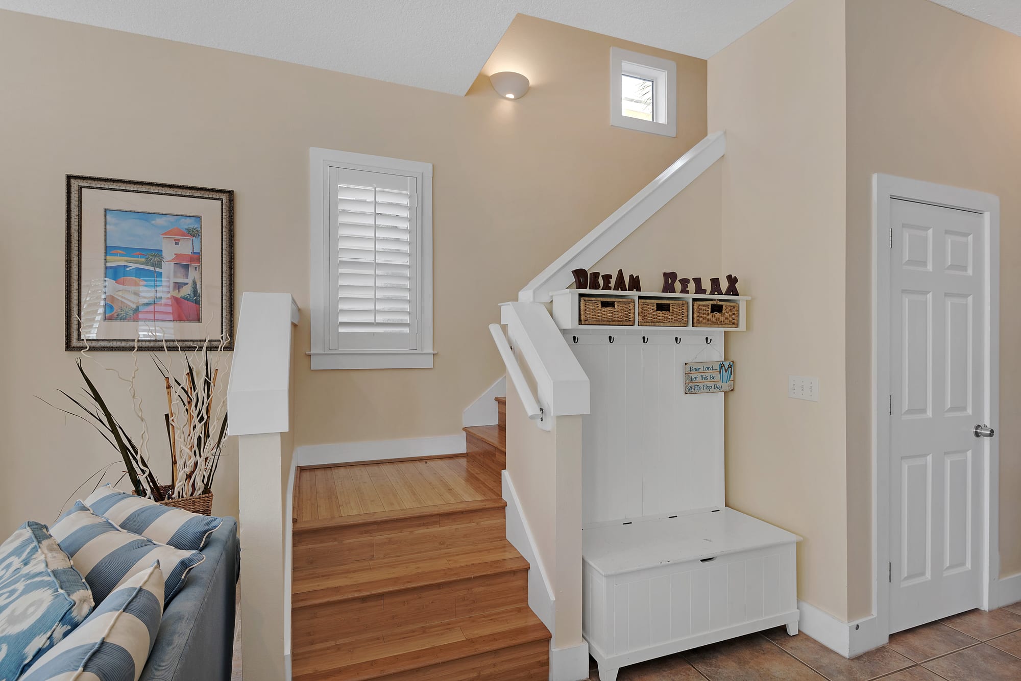 Stairway to second floor w/master and guest bedrooms 