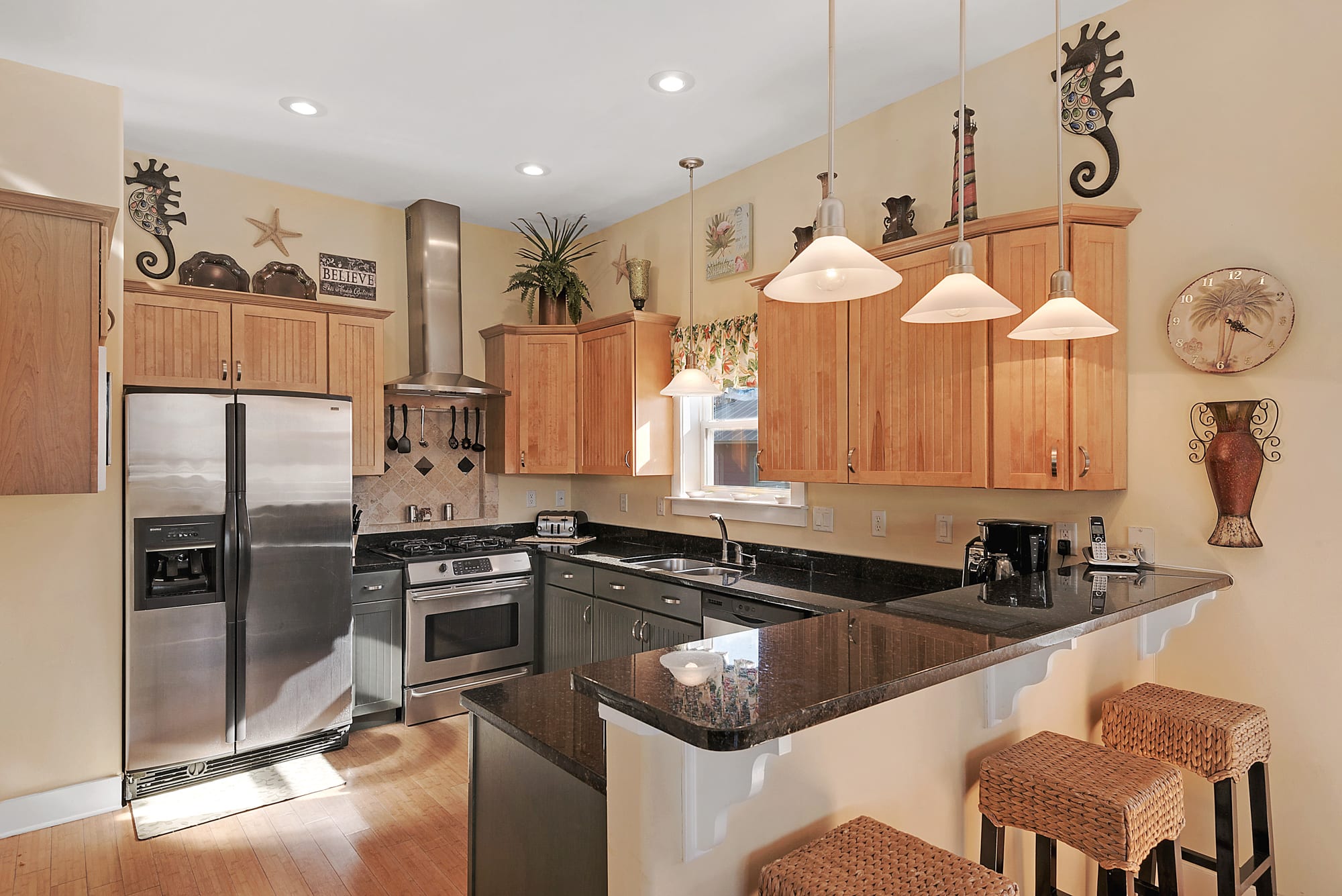 Beautiful custom kitchen w/ granite counters, stainless appliances and gas stove
