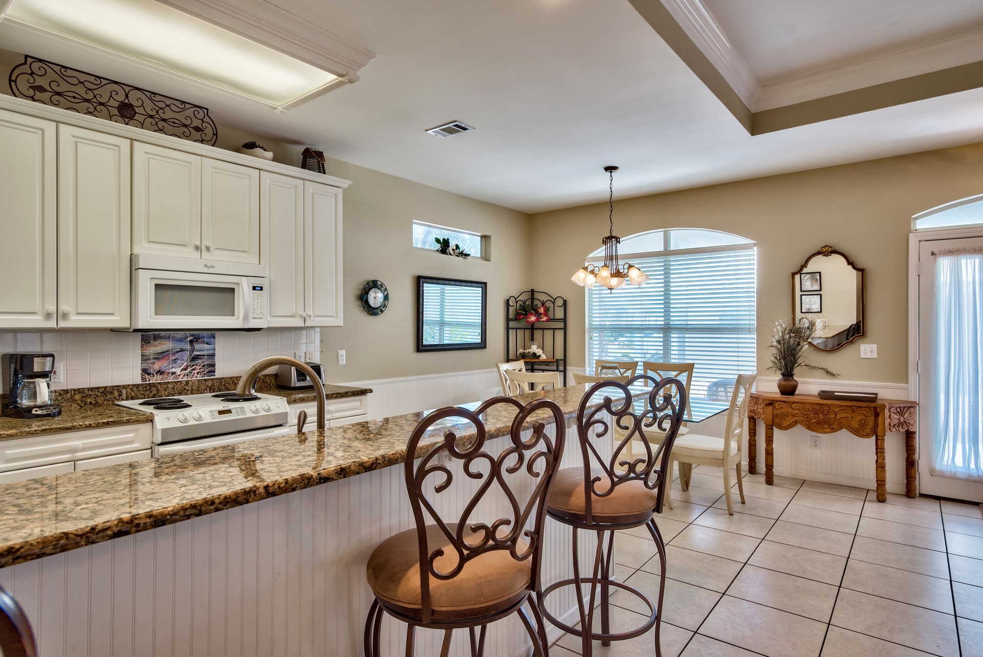 Large kitchen with eat-in counter and dining area
