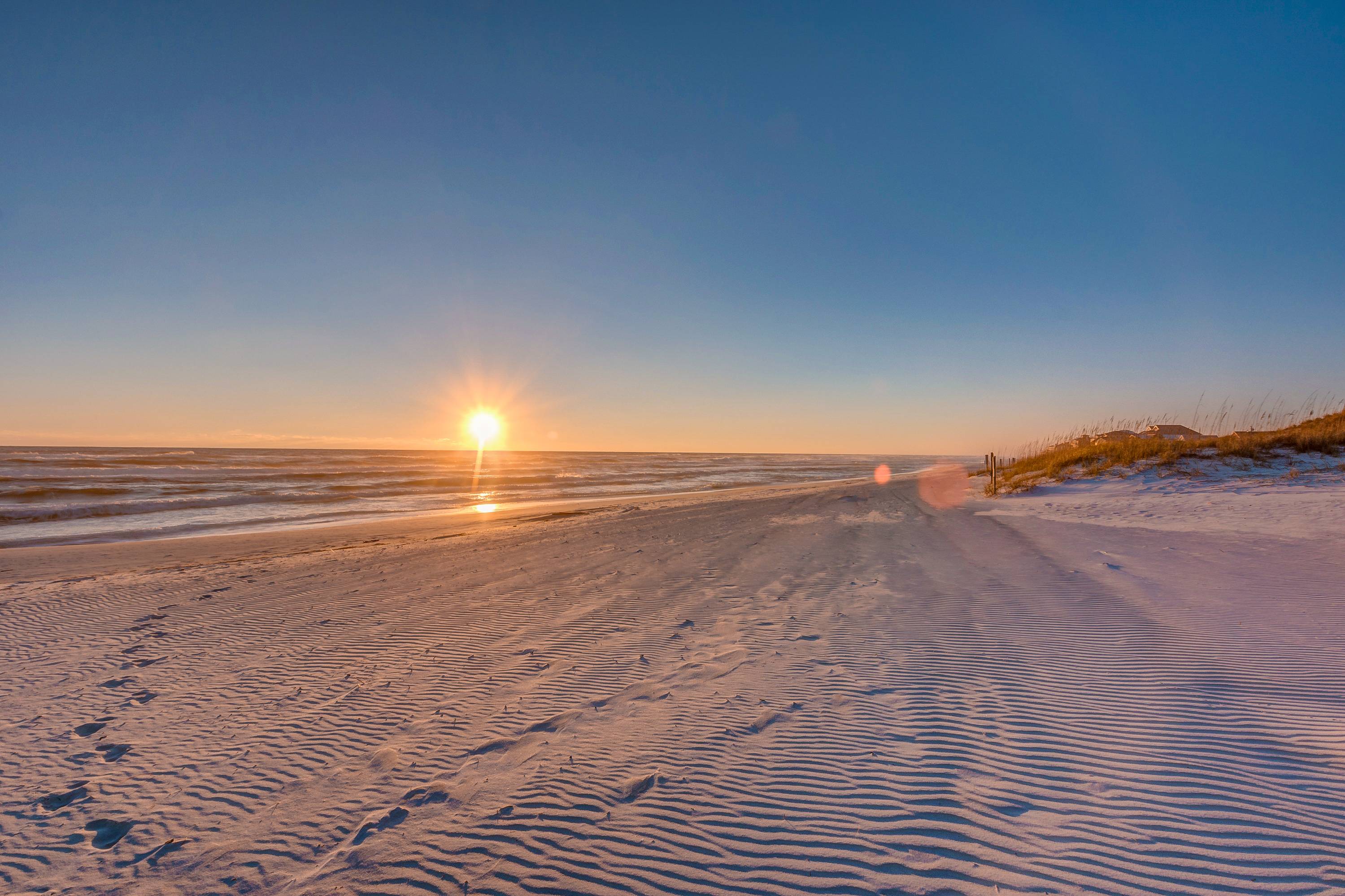 The pristine white sand beaches of the Emerald Coast with breath taking sunsets