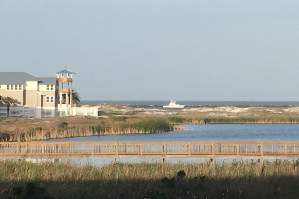 View of the Gulf and the causeway with fishing boats always coming and going!