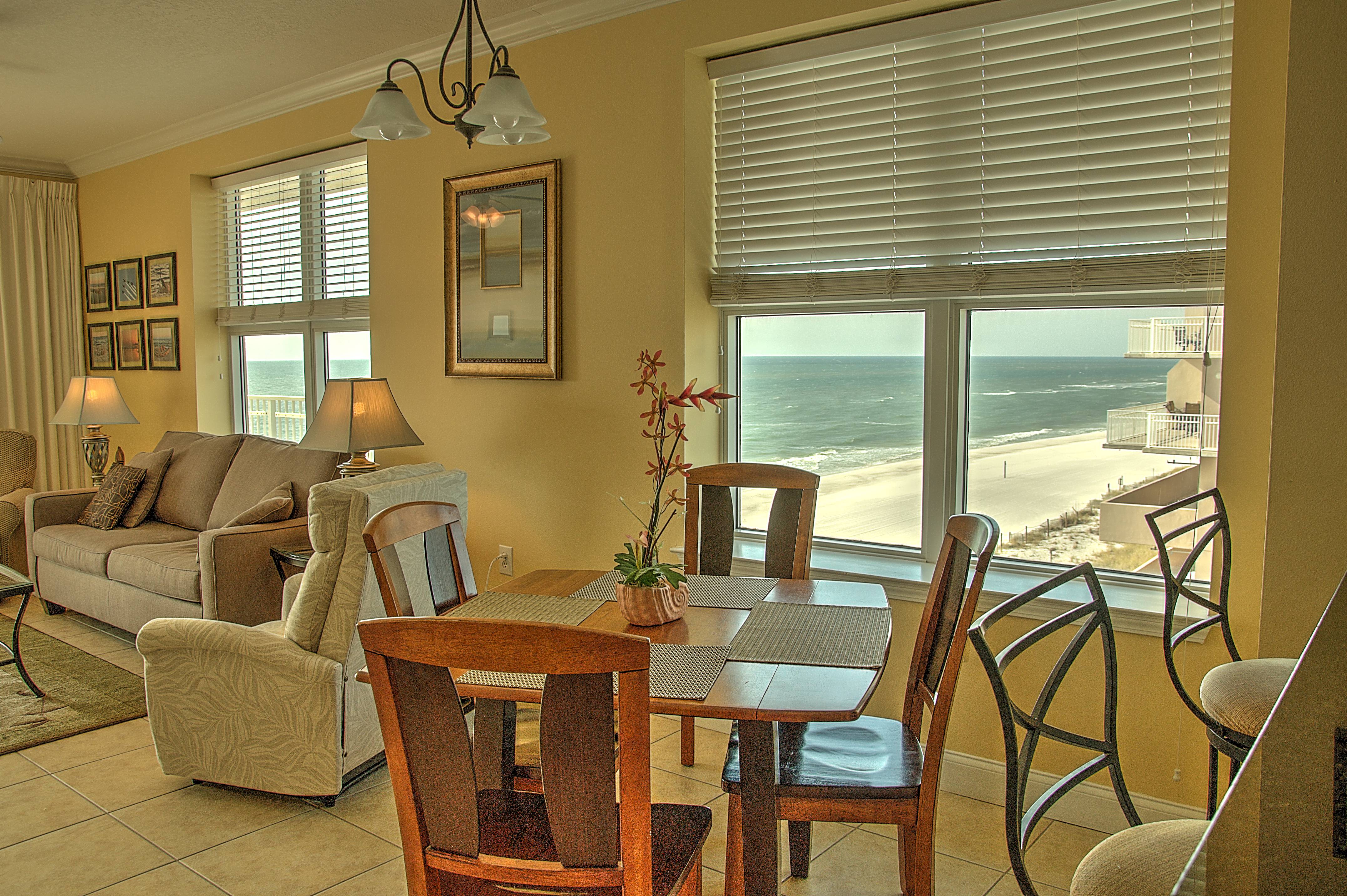 Dining and living areas showing the corner unit's windows