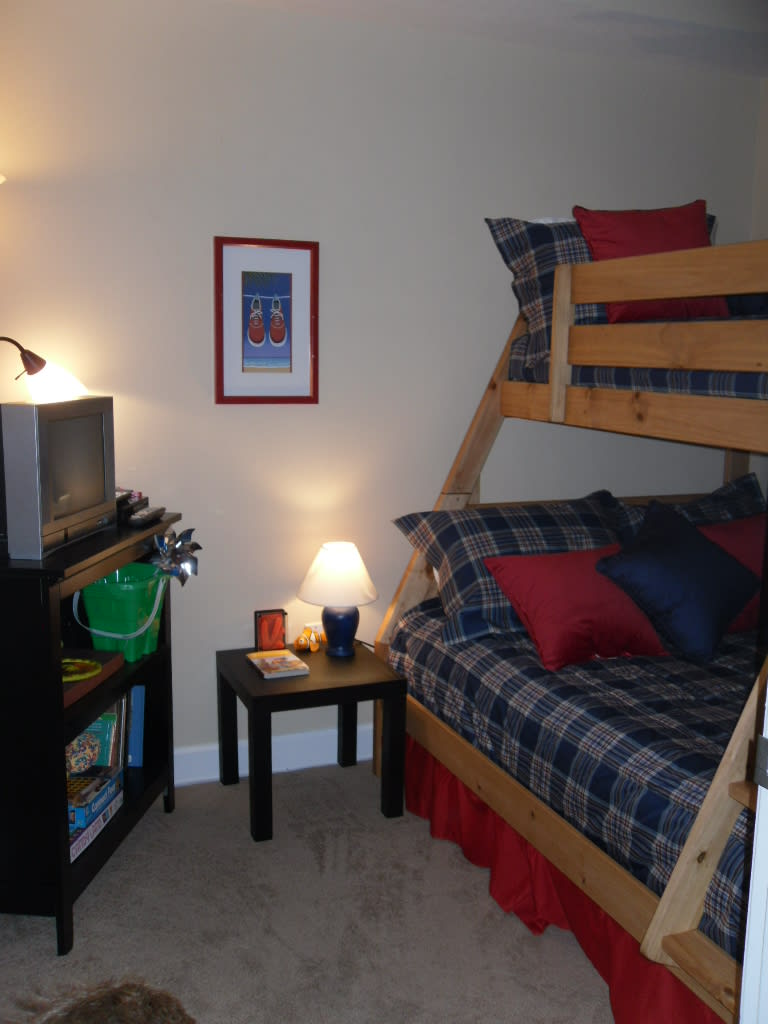 The bunk room has a full/twin bunk bed and a children's library.  