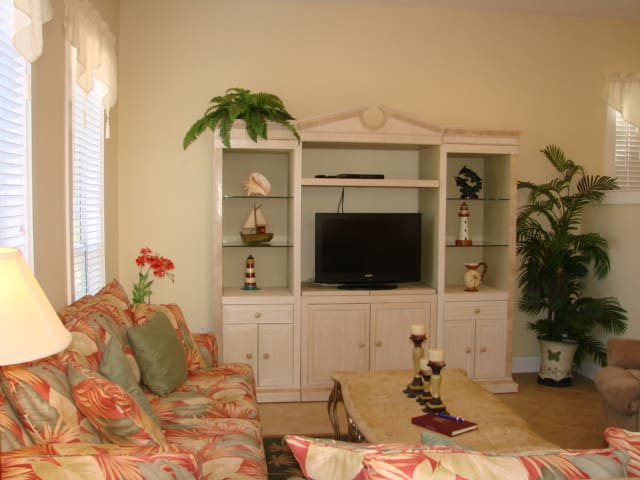 Large flat screen tv and one of the two sofas is a sleeper