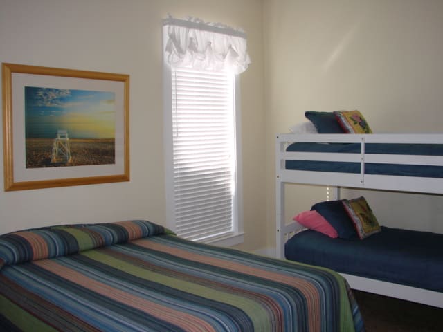 First floor guest bedroom w/ queen bed and twin/twin bunk