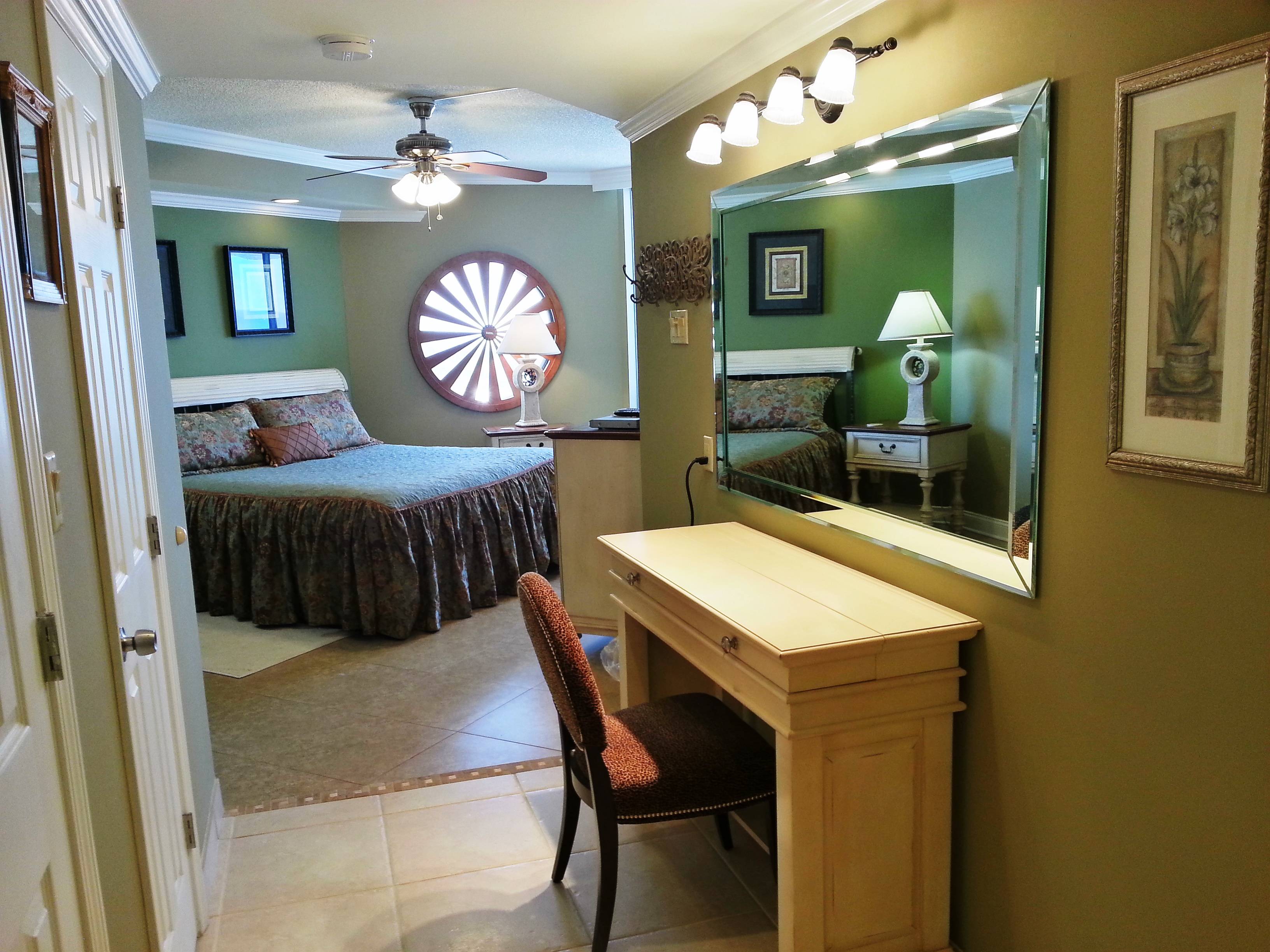 Entrance to the Master Bedroom with a computer/make-up table and chair also a walk-in-closet Entrance to the Master Bedroom with a computer/make-up table and chair also a walk-in-closet