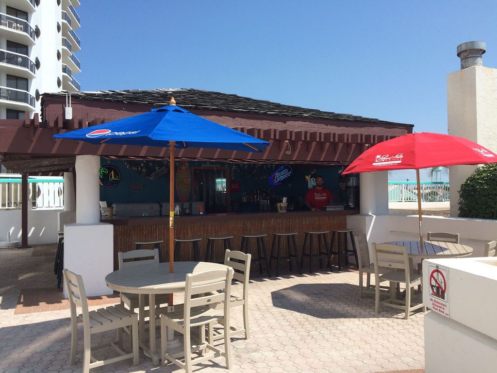 Tiki Hut by the pool serving food and drinks. "Seasonal"