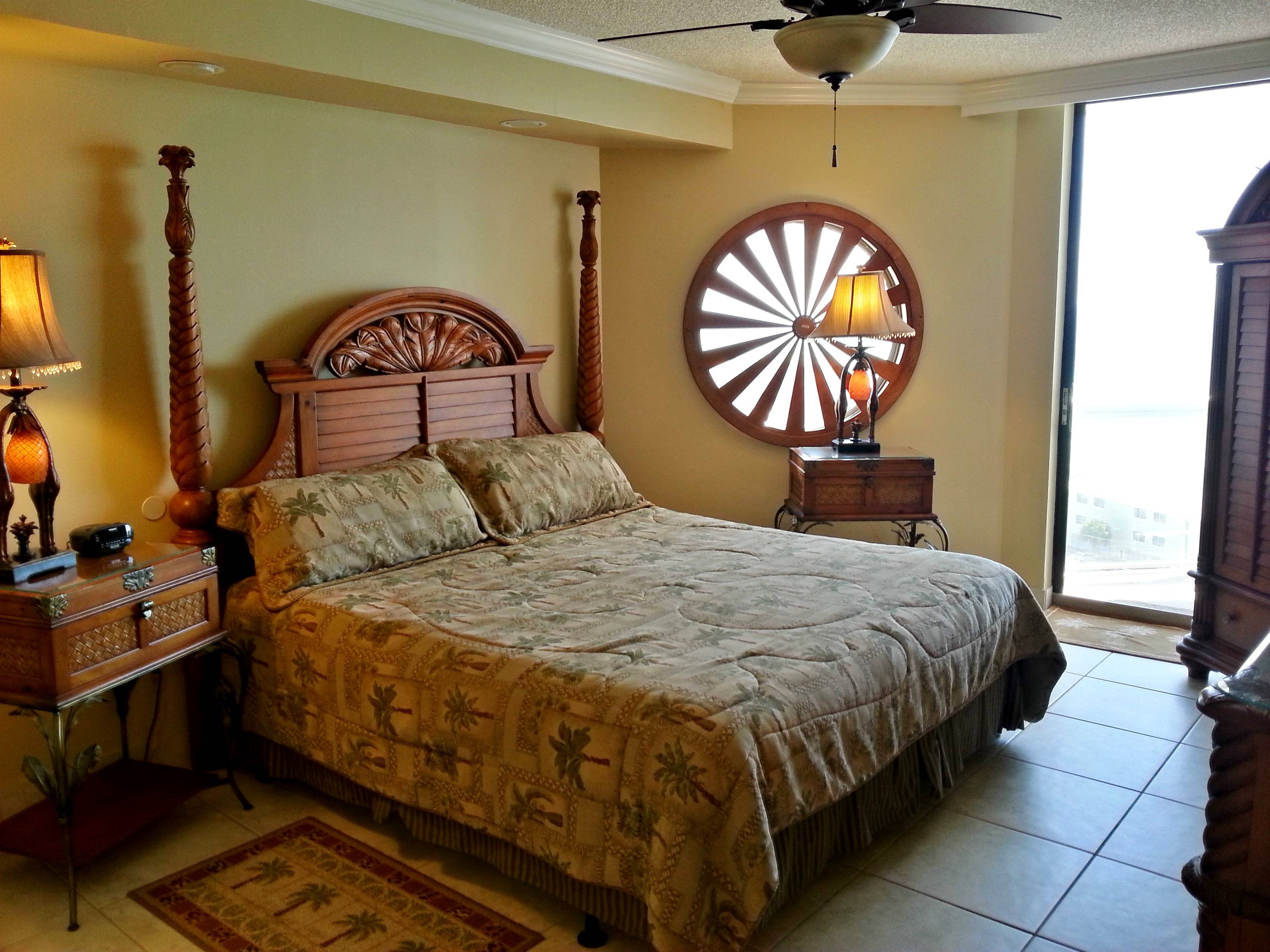 Spacious Master Bedroom King sized bed, Flatscreen TV/DVR clock radio, ceiling fan, large walk-in closet,  Balcony Access