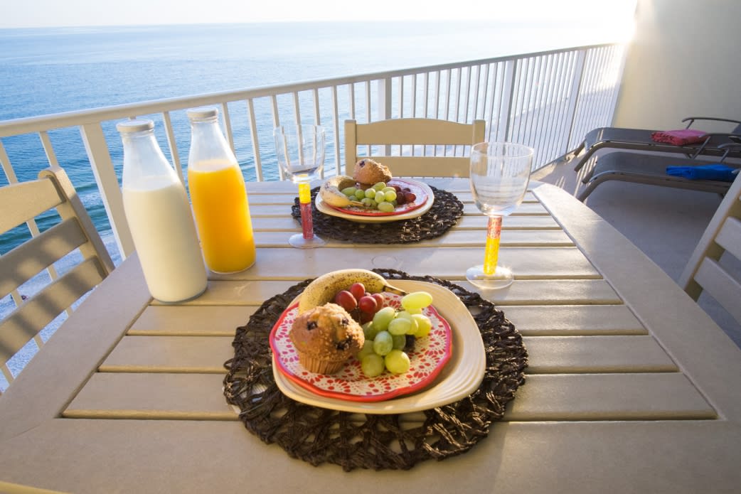 Enjoy a meal from this breathtaking balcony view!