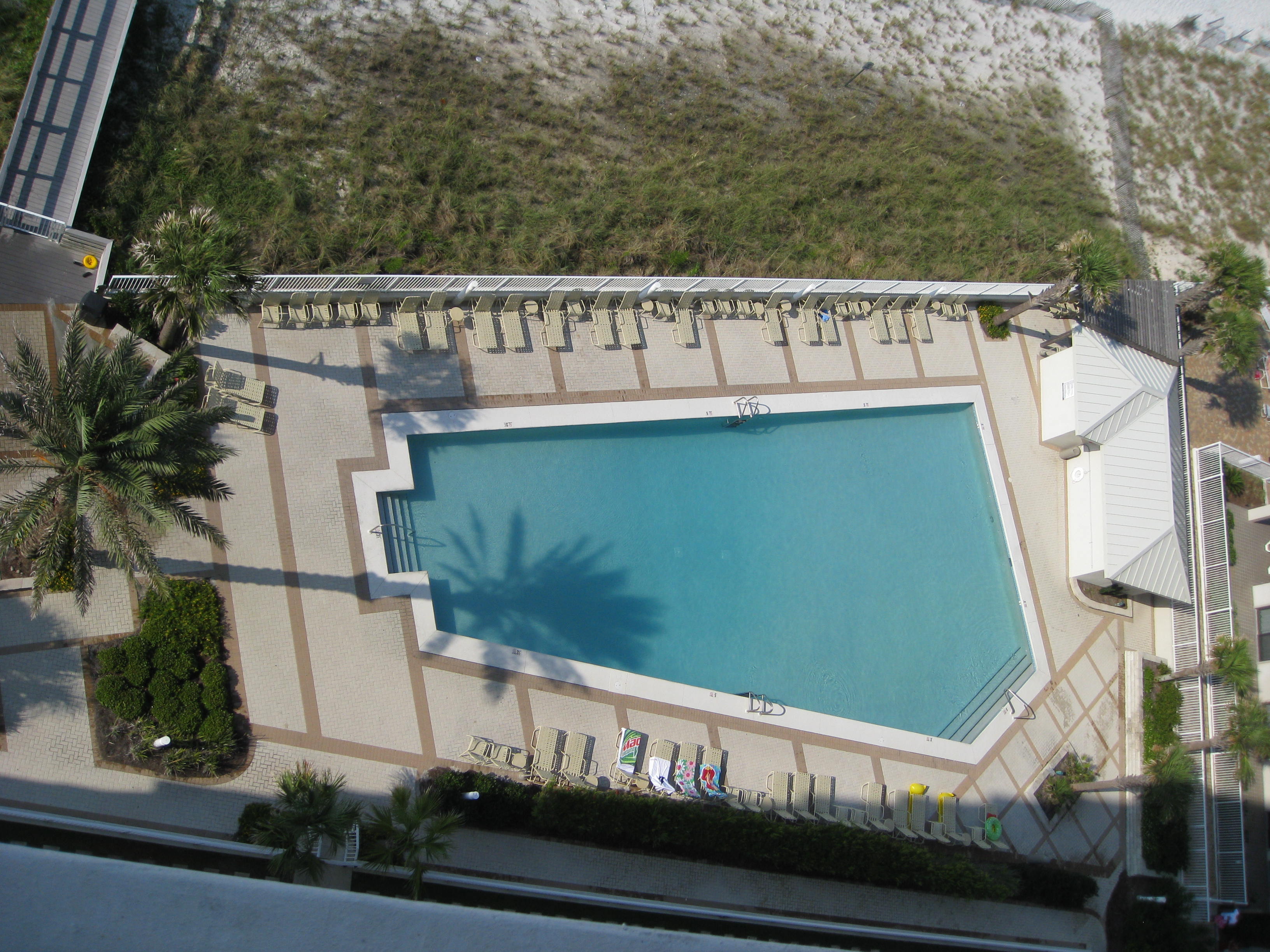 HUGE Oceanfront pool with plentiful lounge chairs-Pool house with restrooms