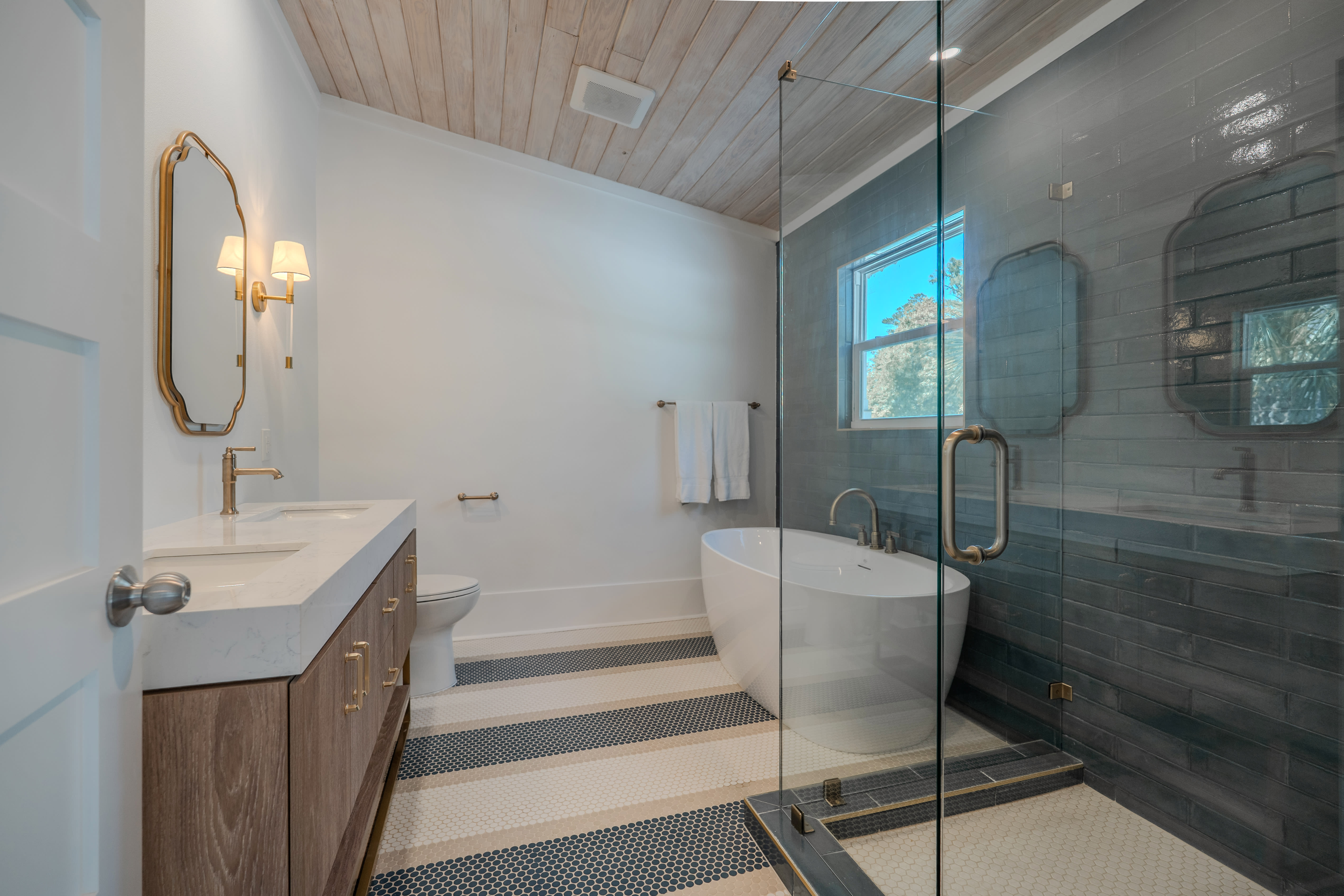 Primary suite 1 ensuite bath with large shower, double vanity and soaking tub