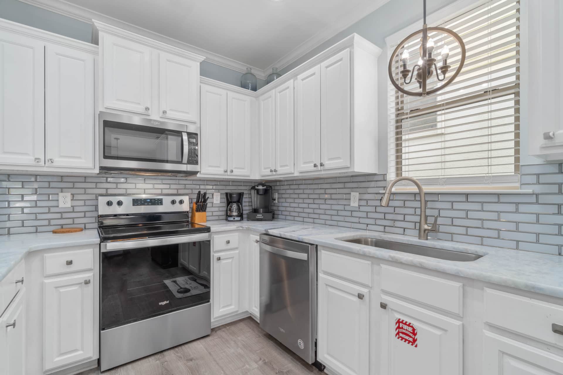 Kitchen stove, oven, microwave, dishwasher, and sink