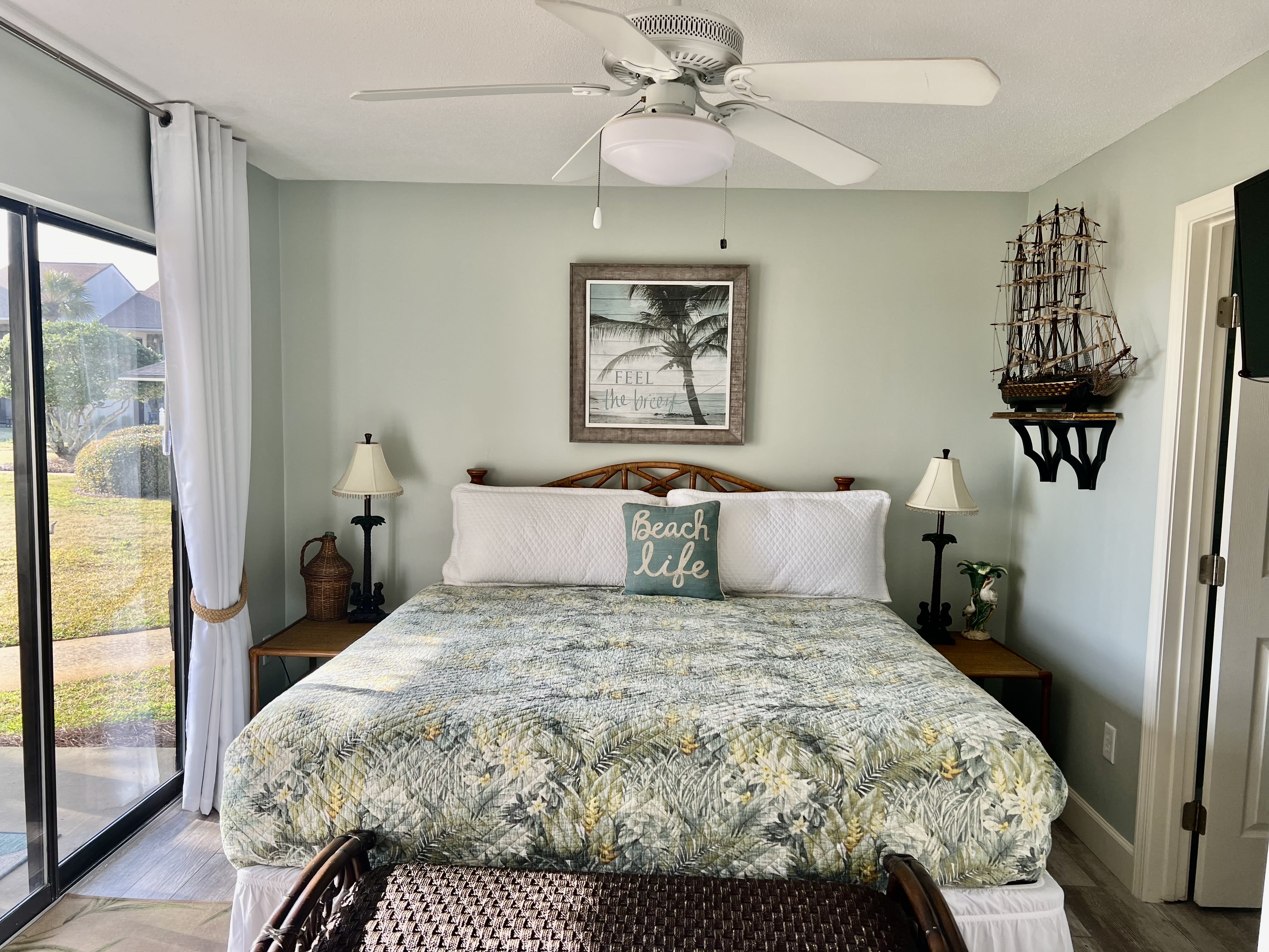 Newly redecorated downstairs bedroom off patio.  King bed; ensuite bathroom