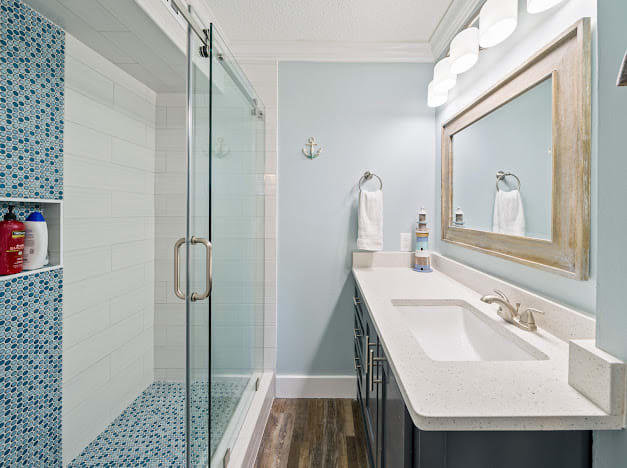 Attached master bath with walk in tile shower.
