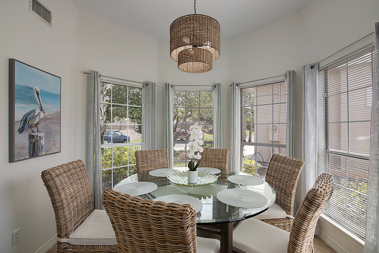 A lot of natural light in the dining area.