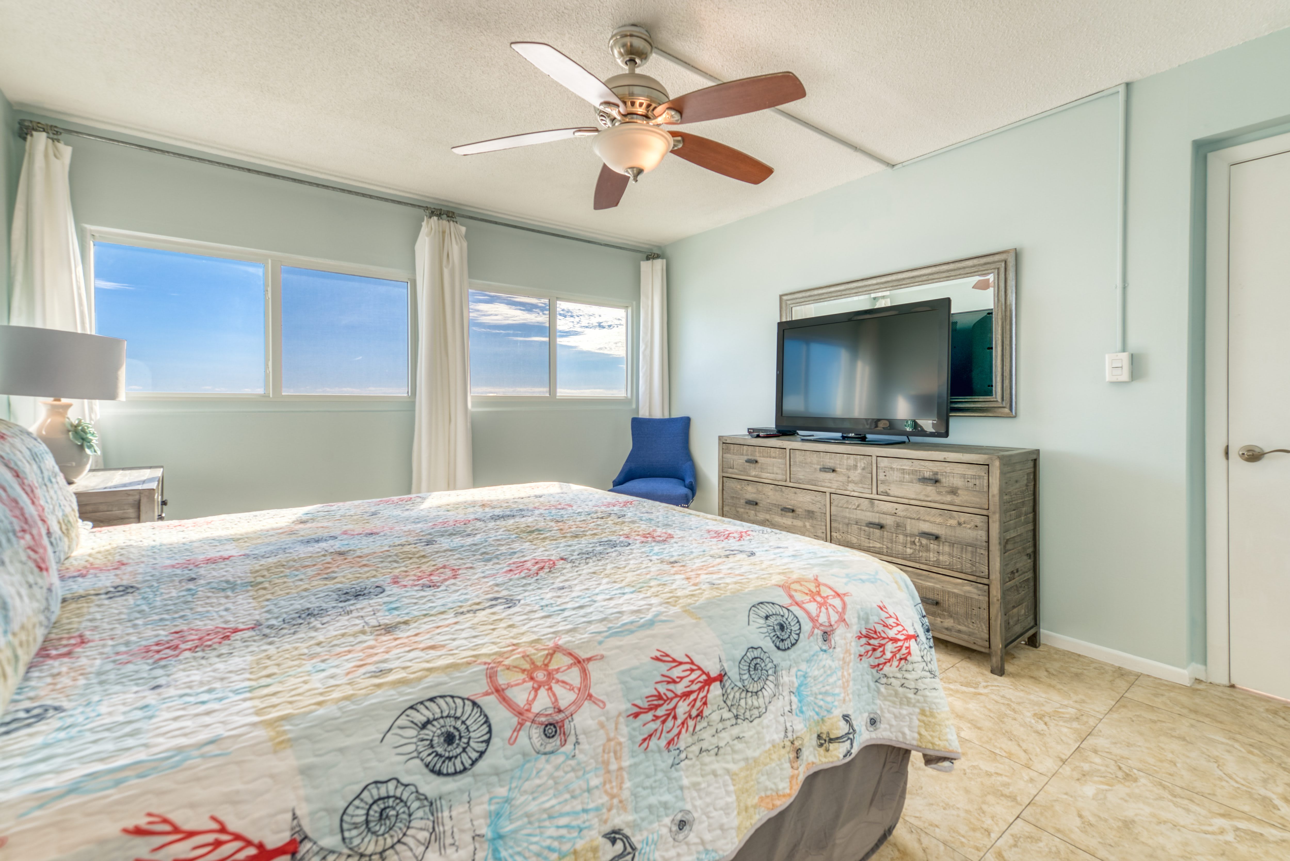 Unwind in this cozy king bedroom with a TV for your entertainment.