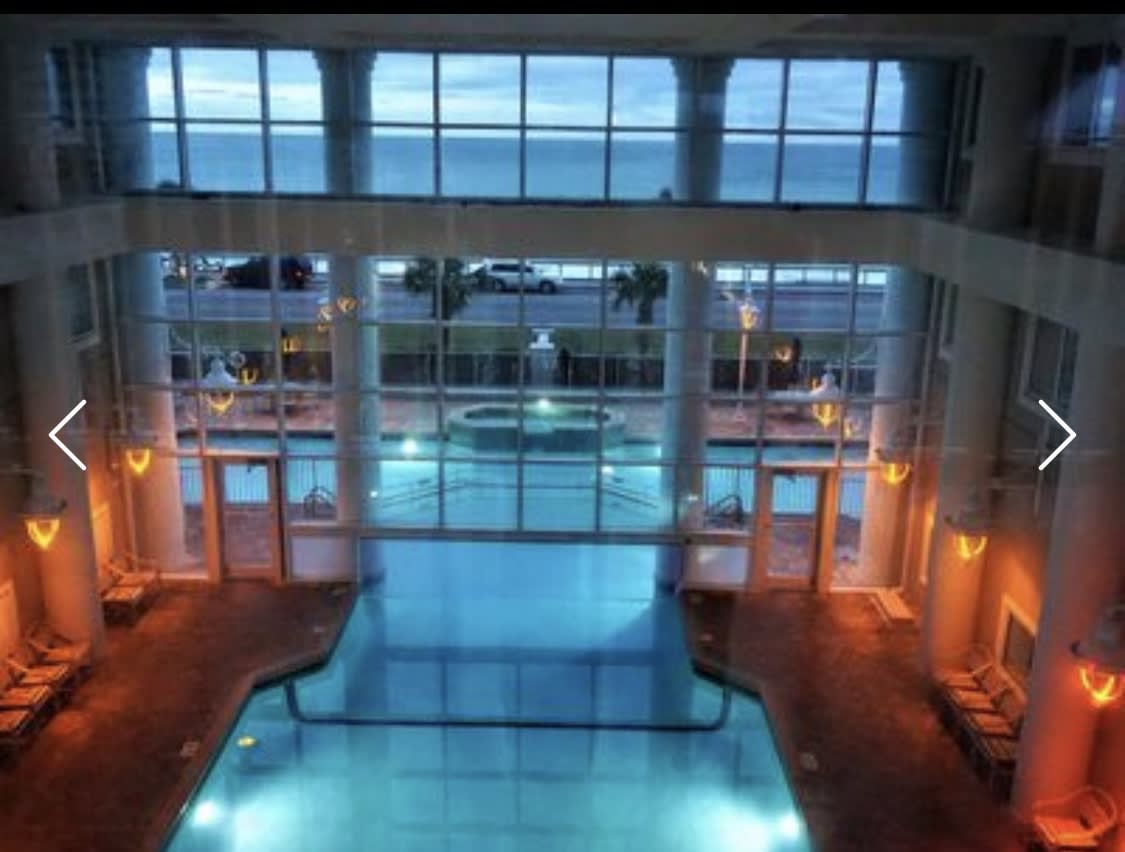 Indoor heated pool that flows outside is beautiful at dusk