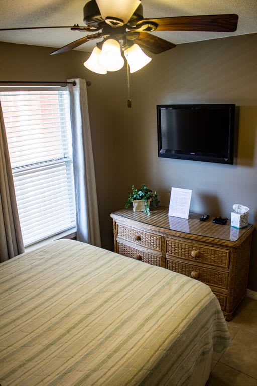 Queen bed, LED flat screen television, Room darkening curtains, and plenty of drawer storage