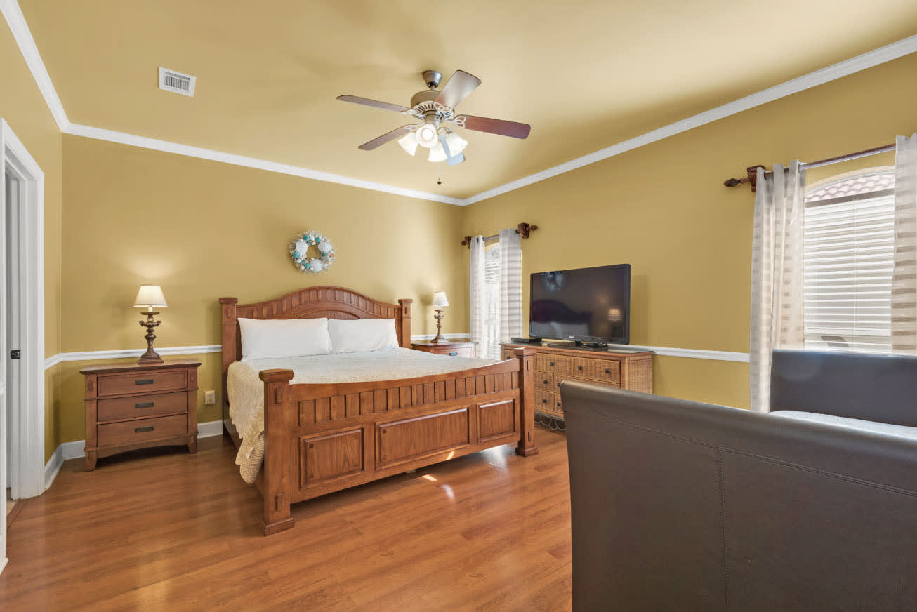 Master Bedroom with King size bed and smart tv.