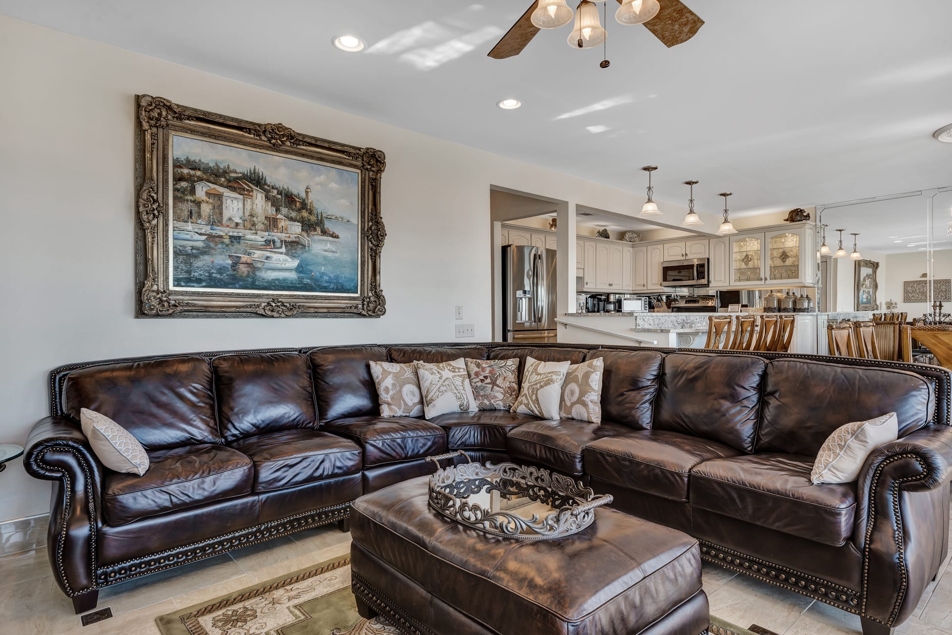 Family Room having Large Sectional and Original Art on Wall