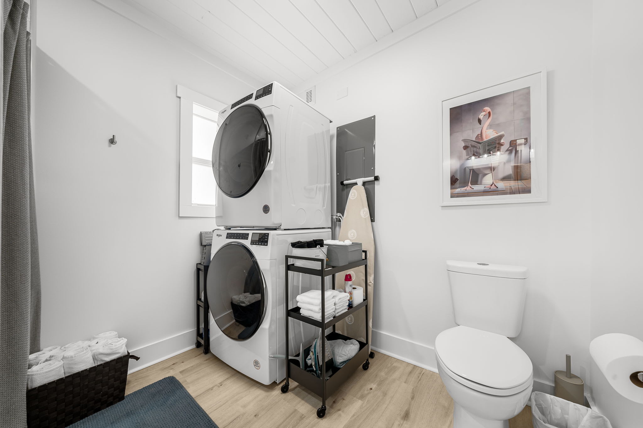 Large bathroom also houses a full-size stacking washer/dryer