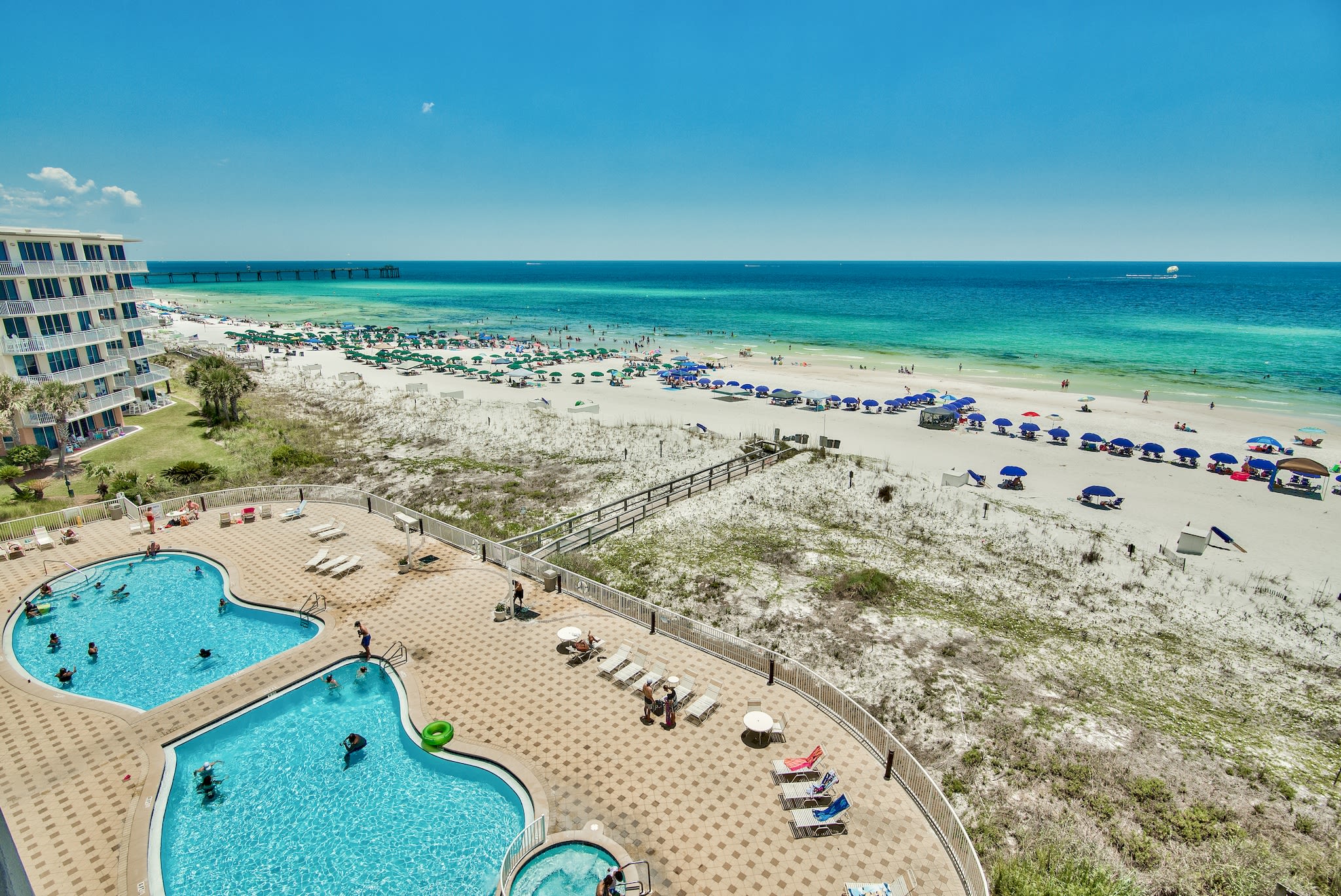 Summer Place has a spacious pool deck with 2 large pools and a hot tub!