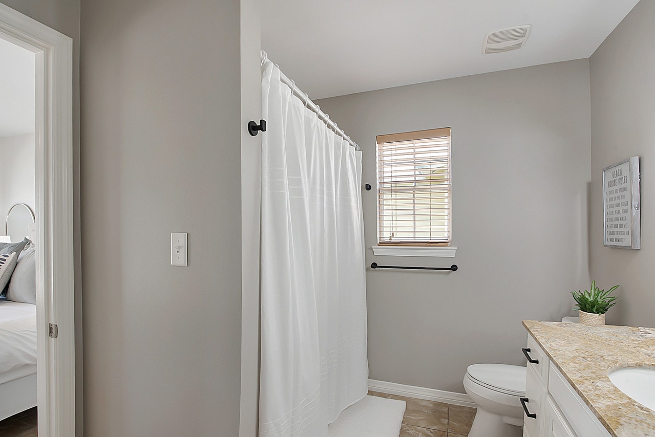 Lower level bathroom, tub/shower connected to one of the lower king bedrooms.