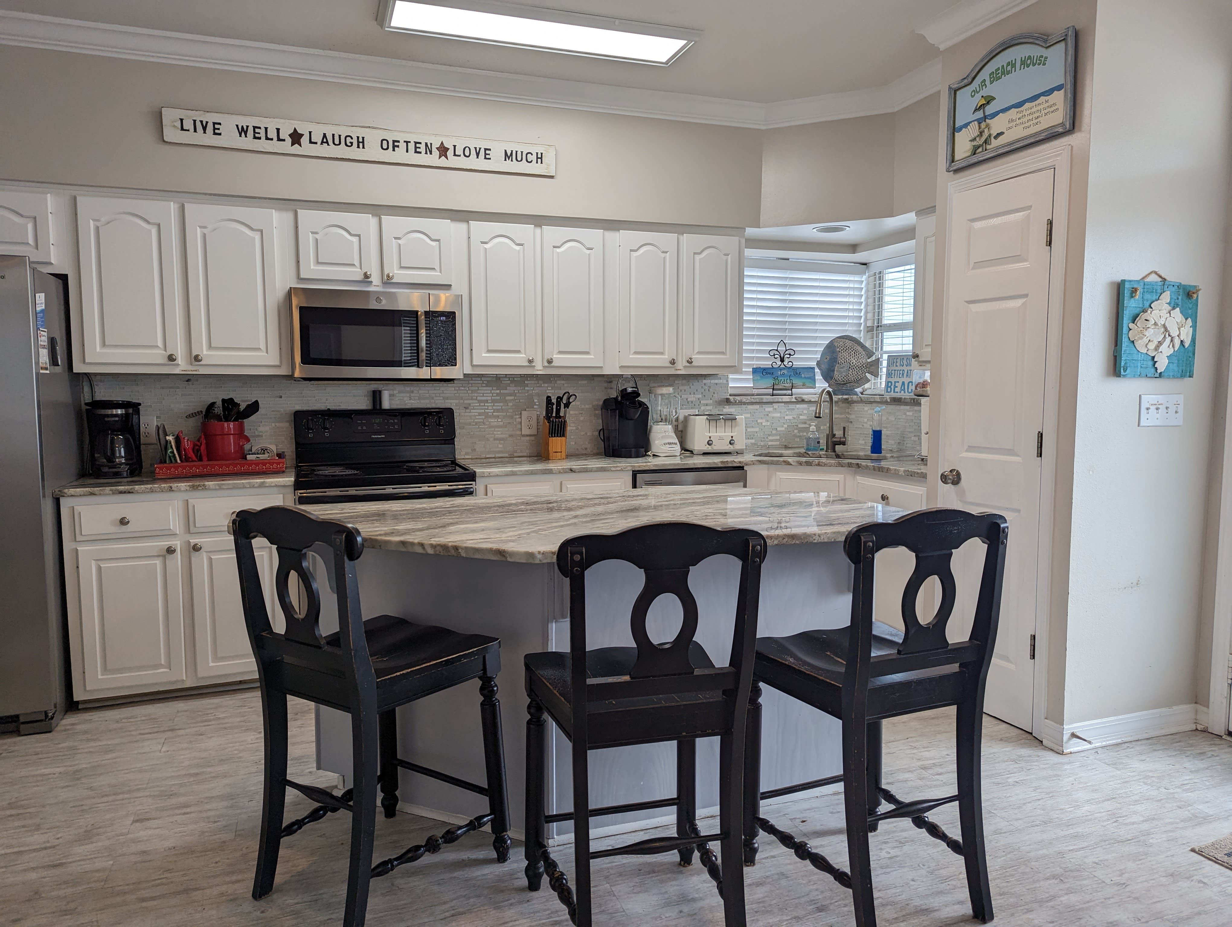 kitchen area with solid surface island and counters.