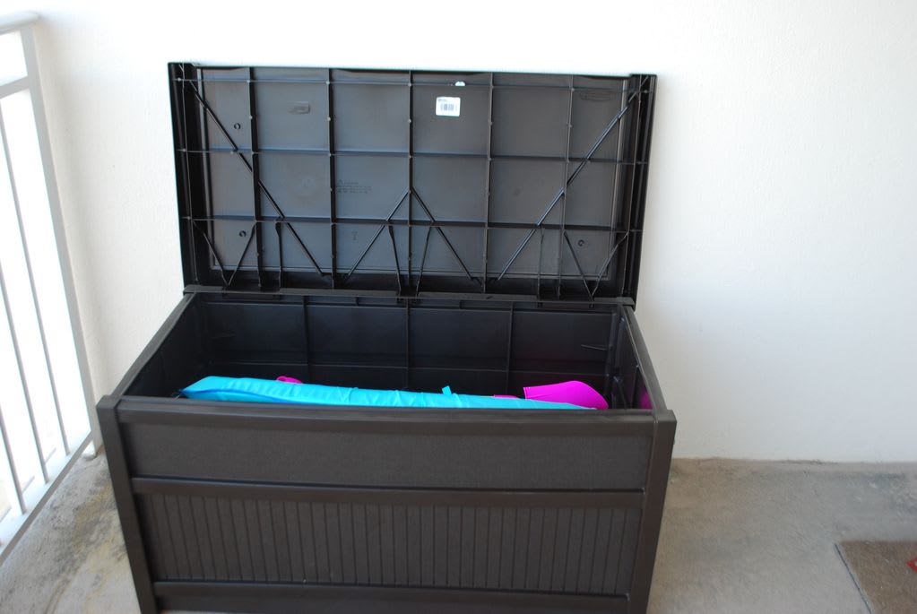 deck box filled with beach toys.