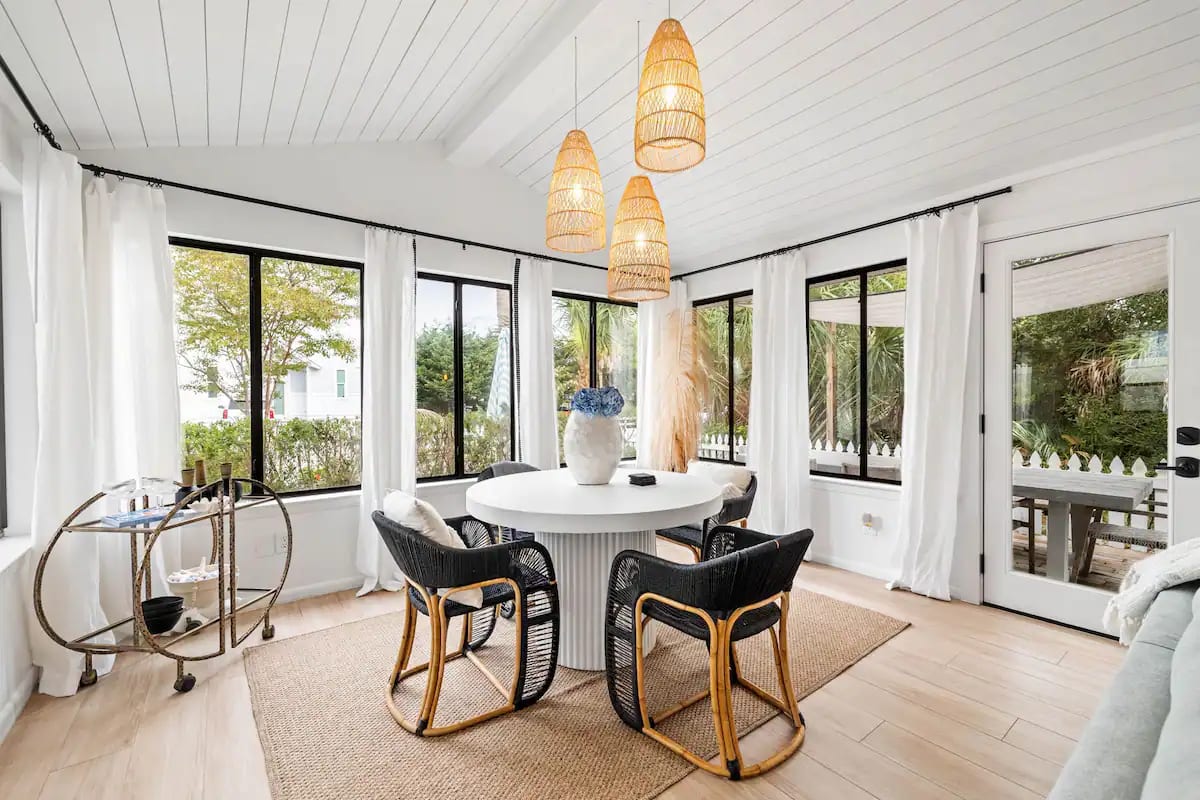 Dining area with Shiplapped ceilings and posh bar cart 